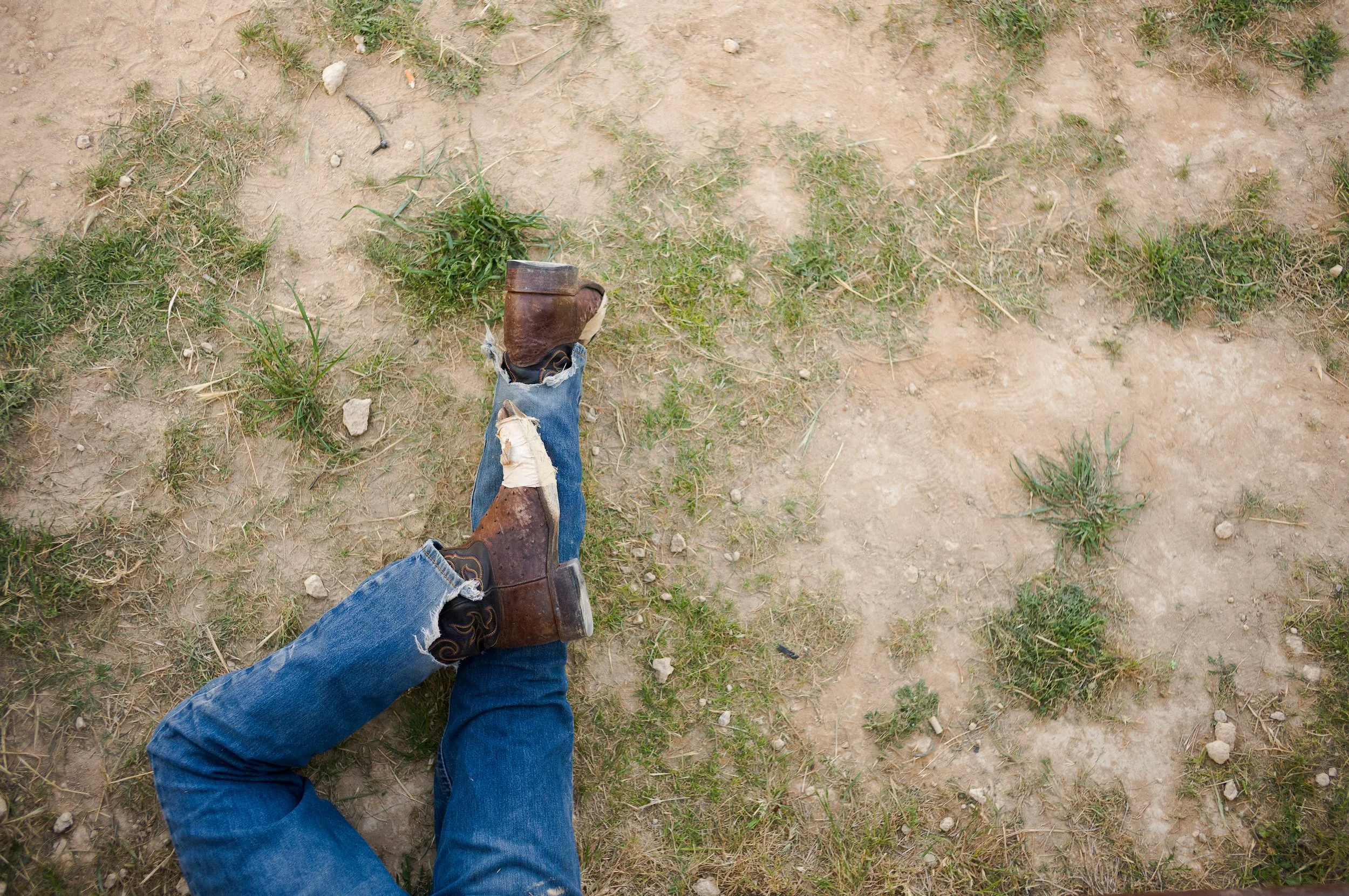 Stephenville Texas - Cowboy lying on the grass