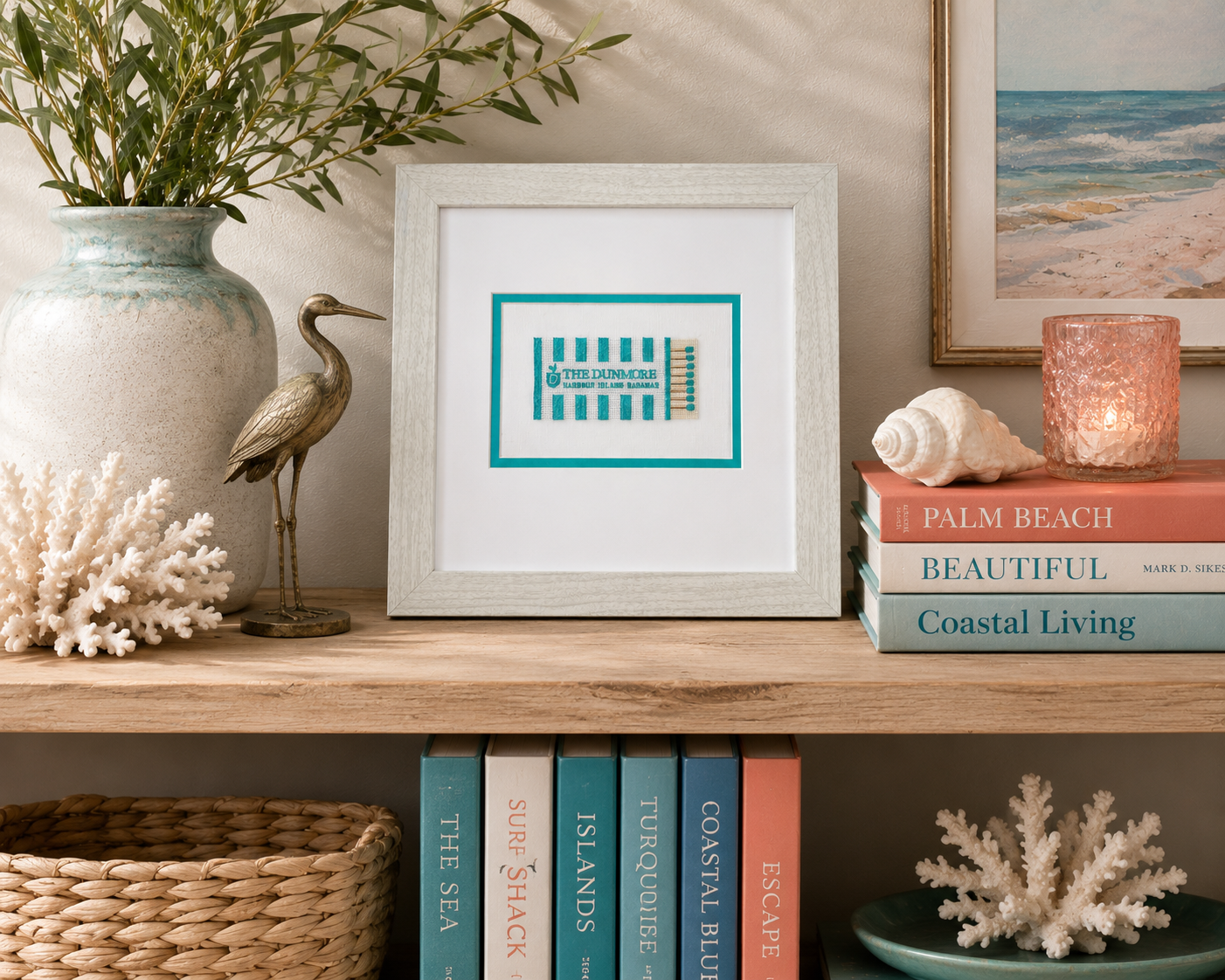 Framed Dunmore Harbour Island embroidered matchbook wall art styled on shelf