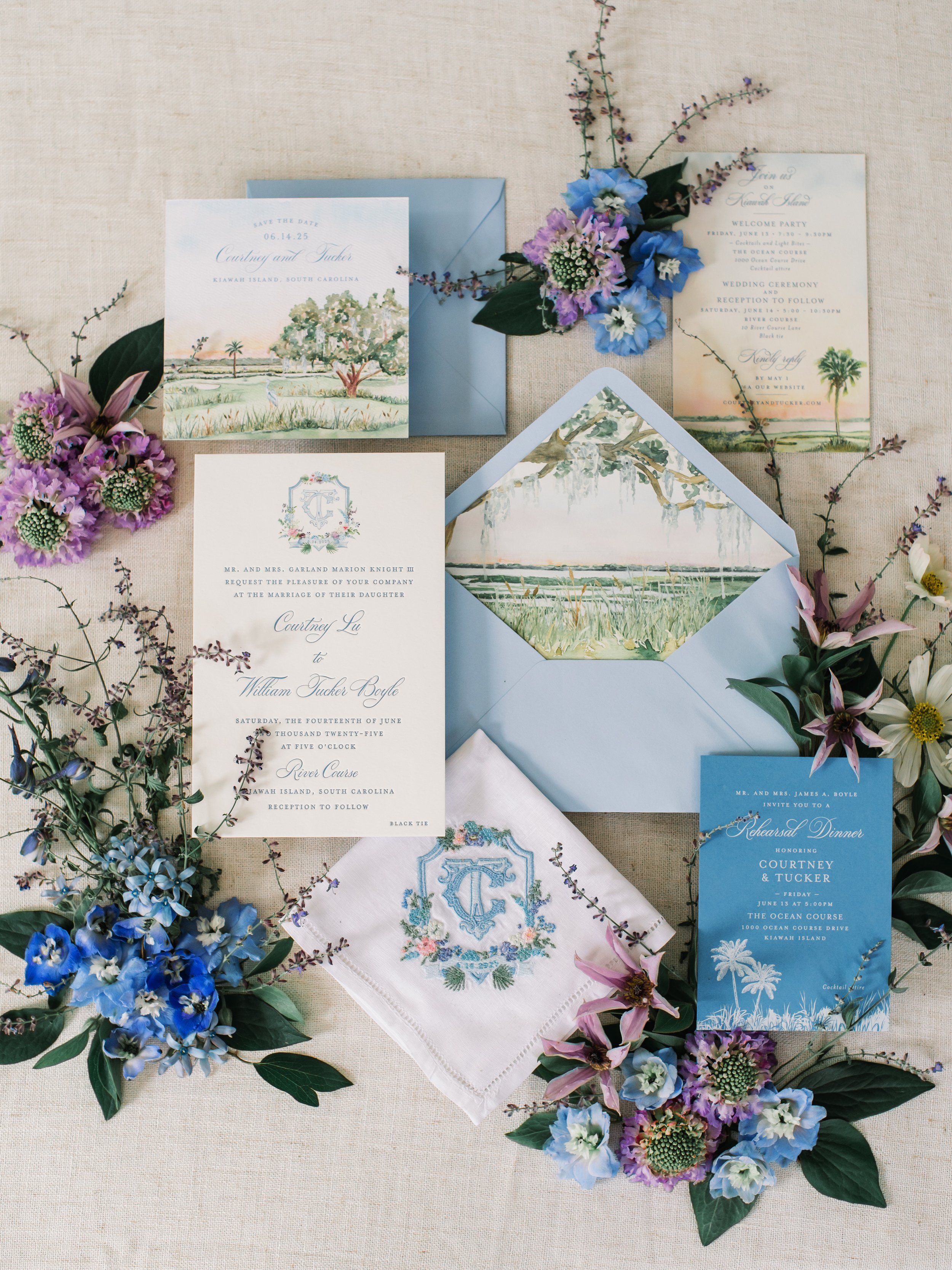 Flatlay with wedding invitation suite and custom embroidered handkerchief.jpg