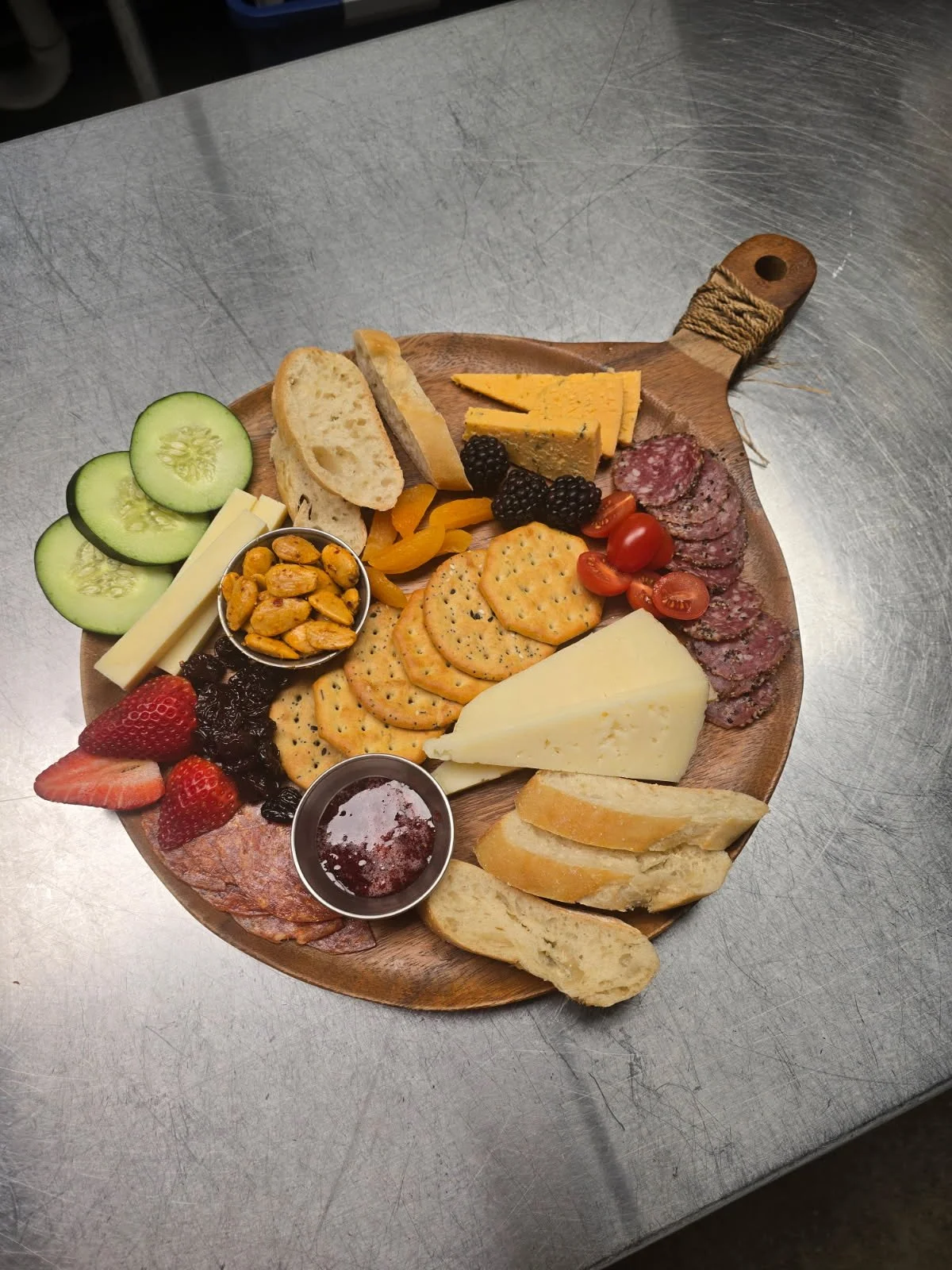 picture of charcuturie board with cheeses, crackers and meats