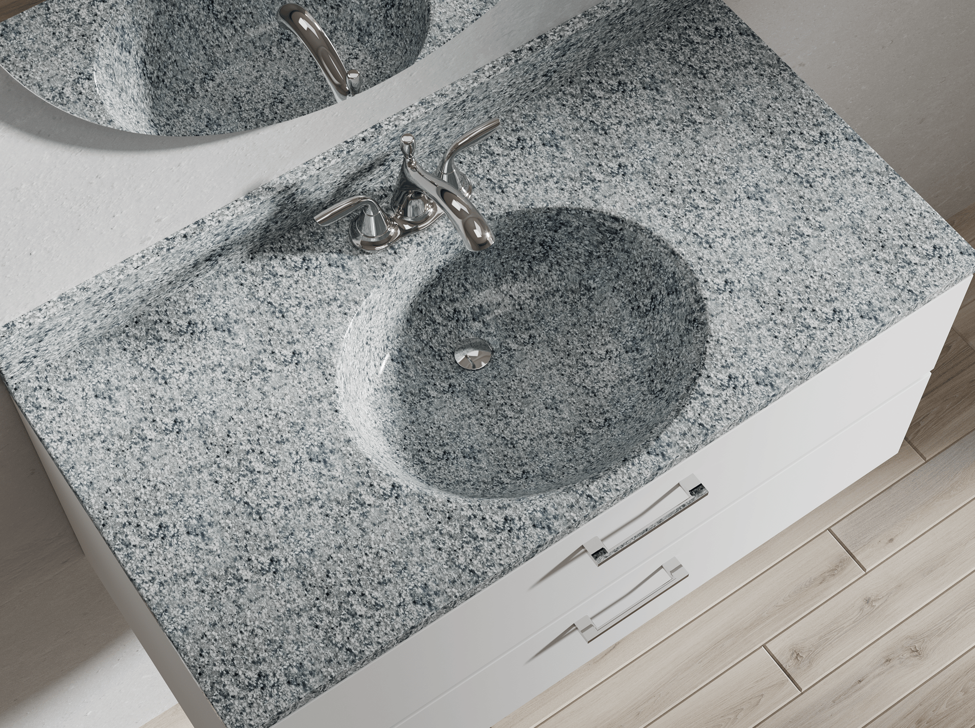 Close-up view of a gray granite bathroom sink with a chrome faucet, set into a matching granite countertop, with a mirror above and white cabinetry underneath.