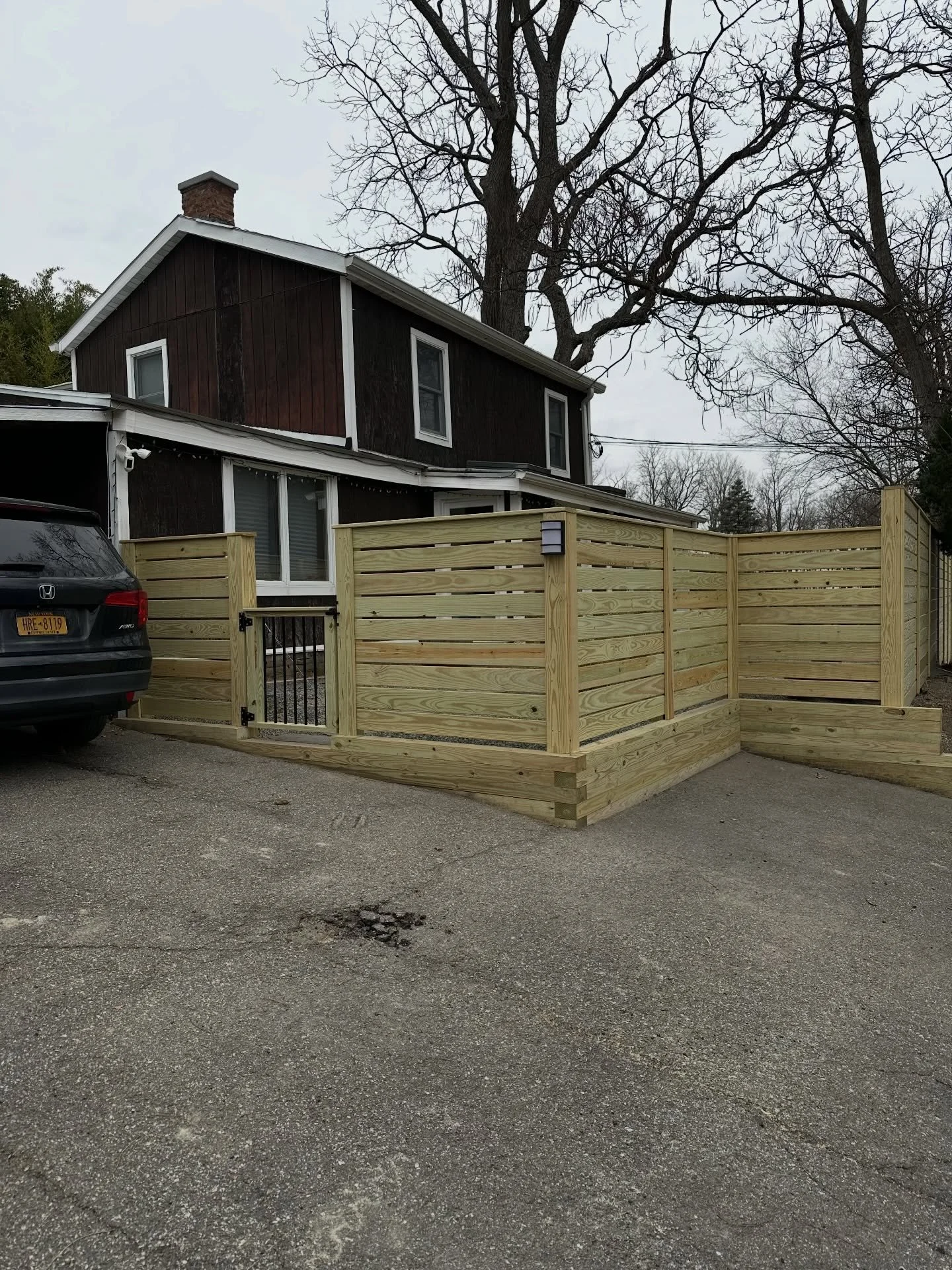 We have been busy outside in these cold temps! Quick pressure treated fence/wall &amp; stair/patio for an existing client&rsquo;s rental property.
