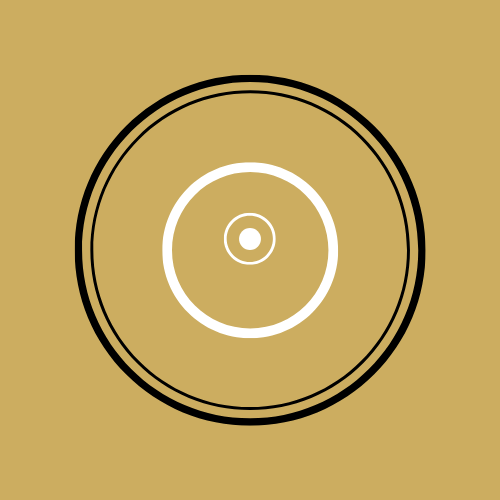 Close-up of a record or vinyl disc on a brown background.