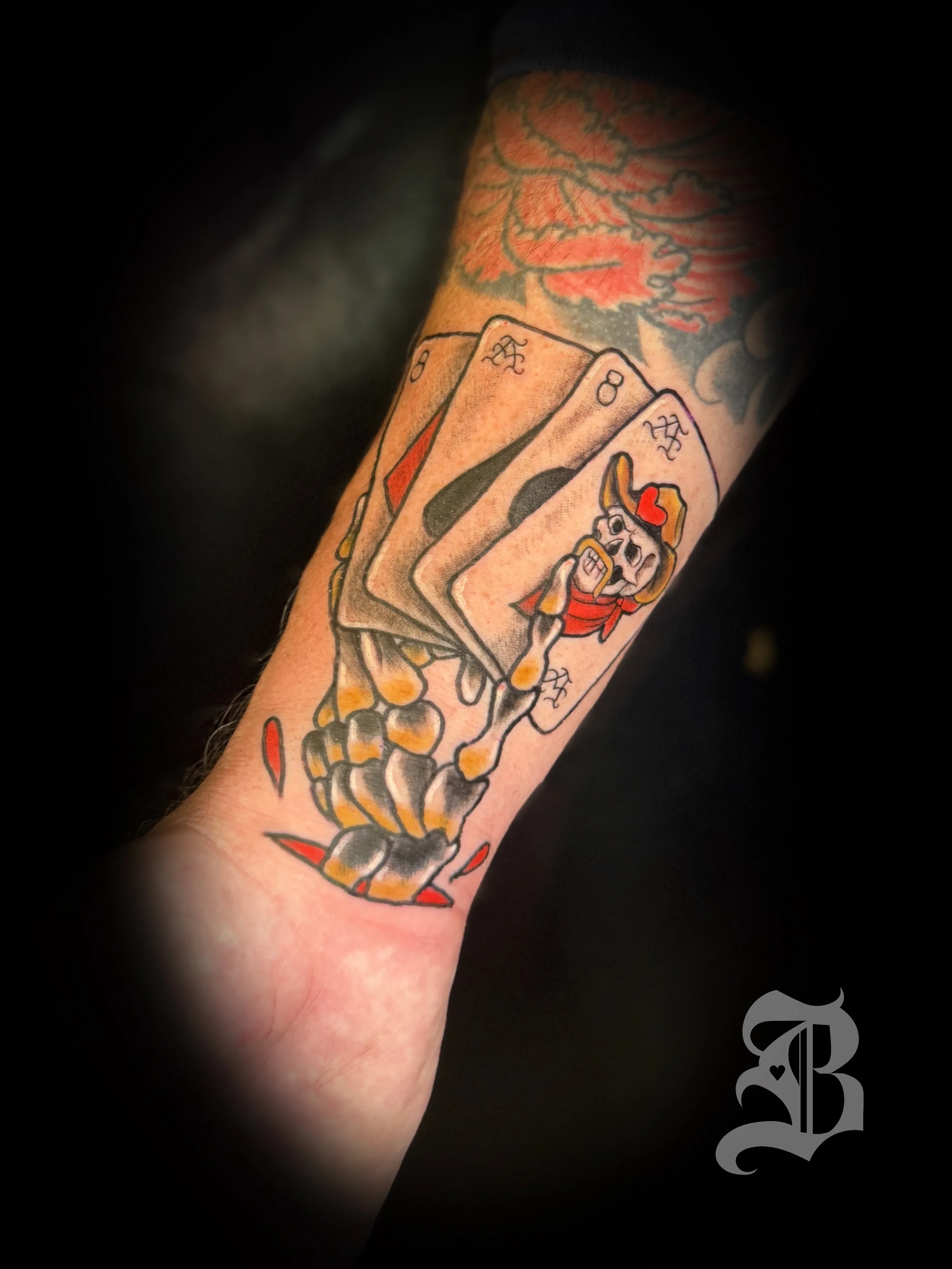 lower forearm traditional Aces and 8s walk-in tattoo.