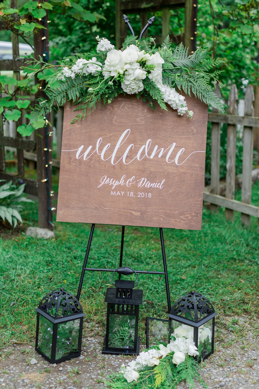  A wooden sign that reads “Welcome, Joseph and Daniel, May 18, 2018. 
