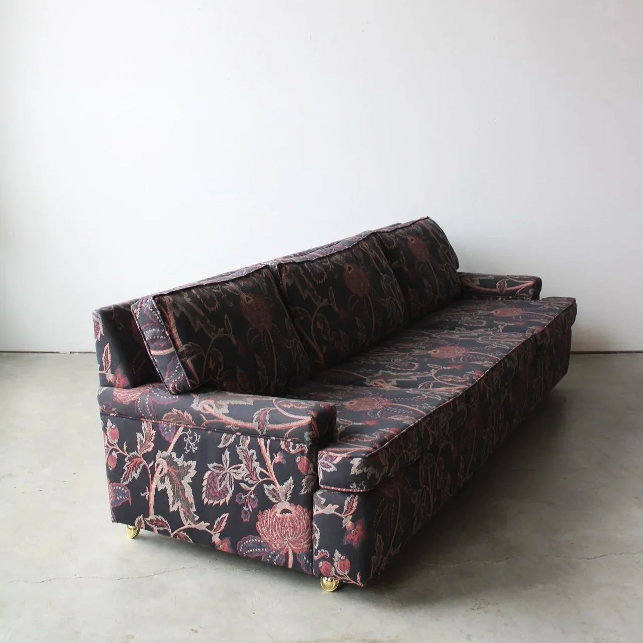 Vintage floral upholstered sofa