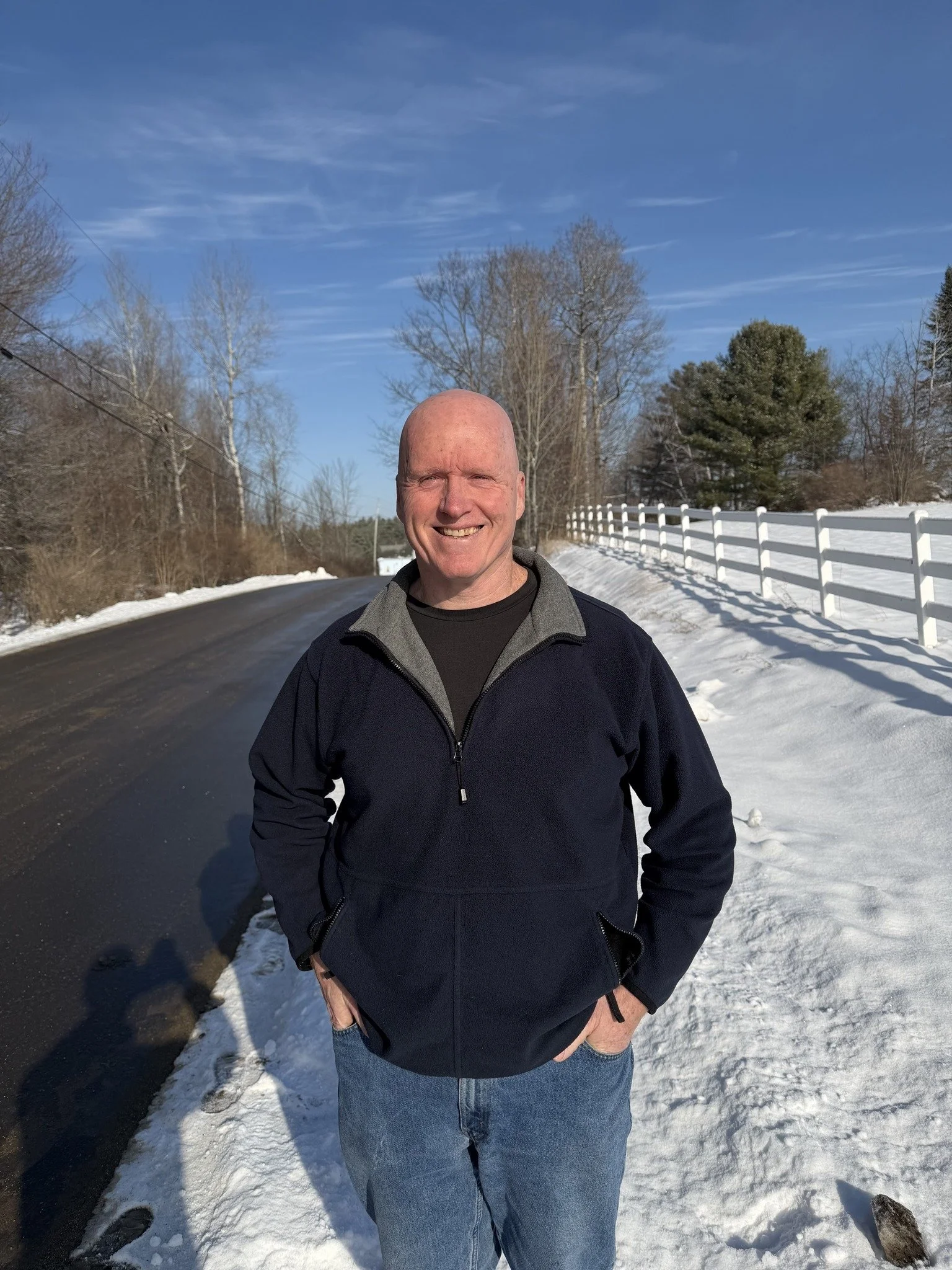 Mike Scott on the snowy road in front of his house