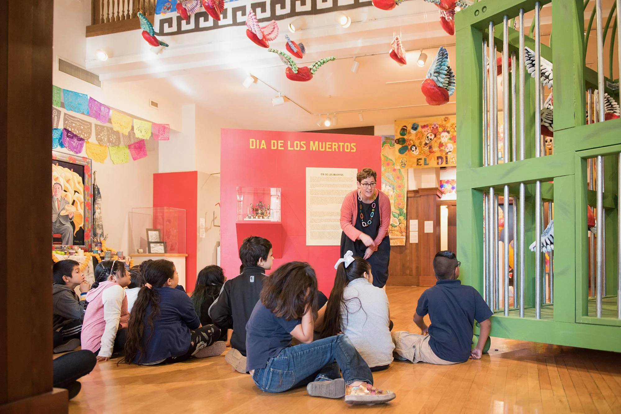 Children listening to a presentation about the art