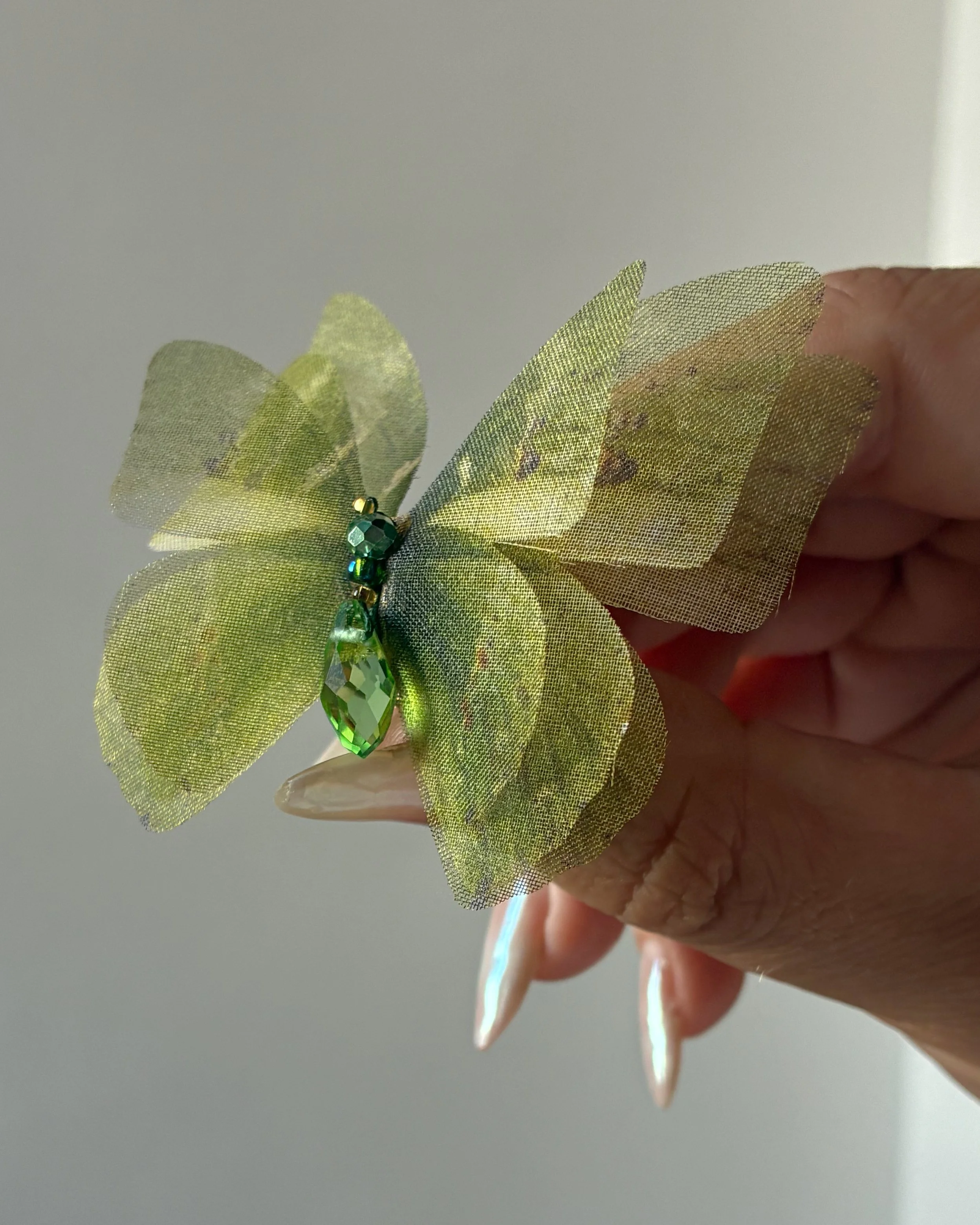 A 3-layered green silk printed wedding butterfly veil weight