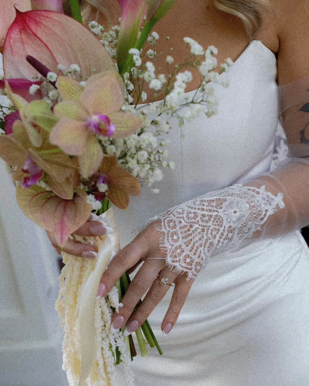 A bride wearing custom created lave gloves