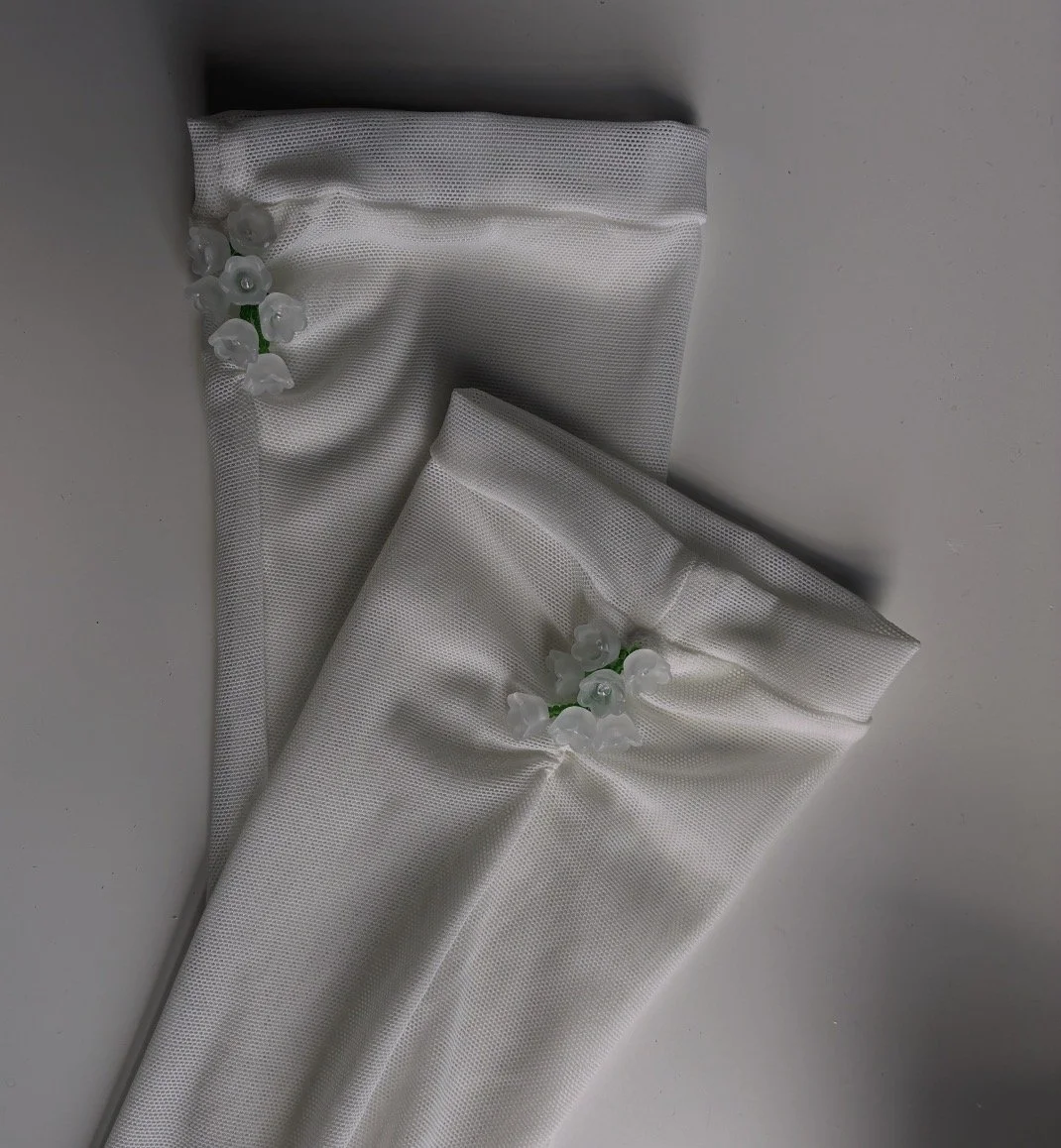 White bridal wedding gloves with flower bead accents