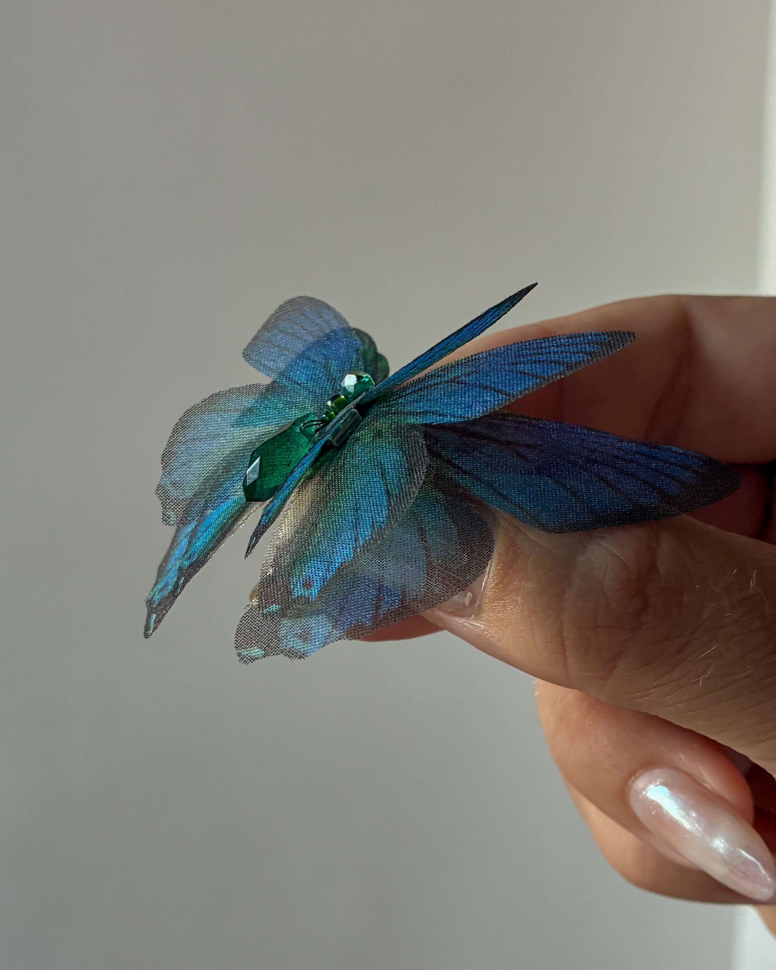 A three layered silk organza butterfly magnet weight for a wedding veil
