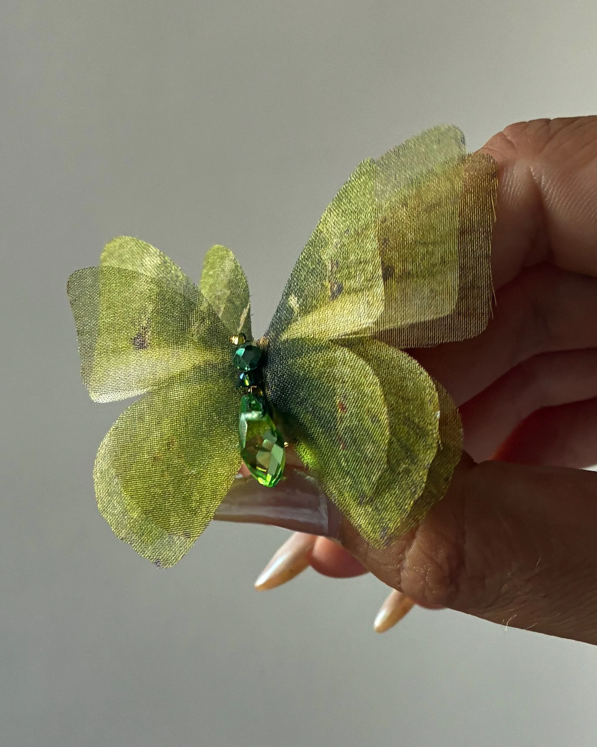 A 3-layered green bridal butterfly veil weight