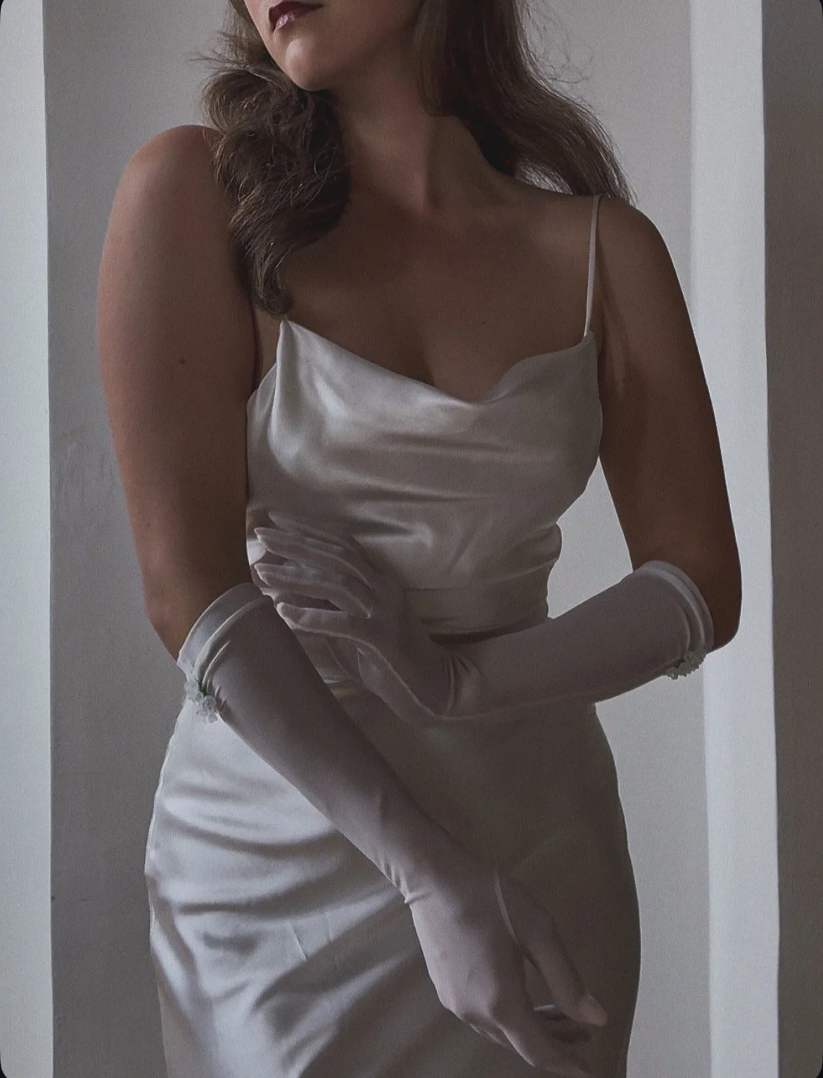 Sheer white stretch wedding, bridal gloves. Elbow length with flowers beaded on the sidetop edge