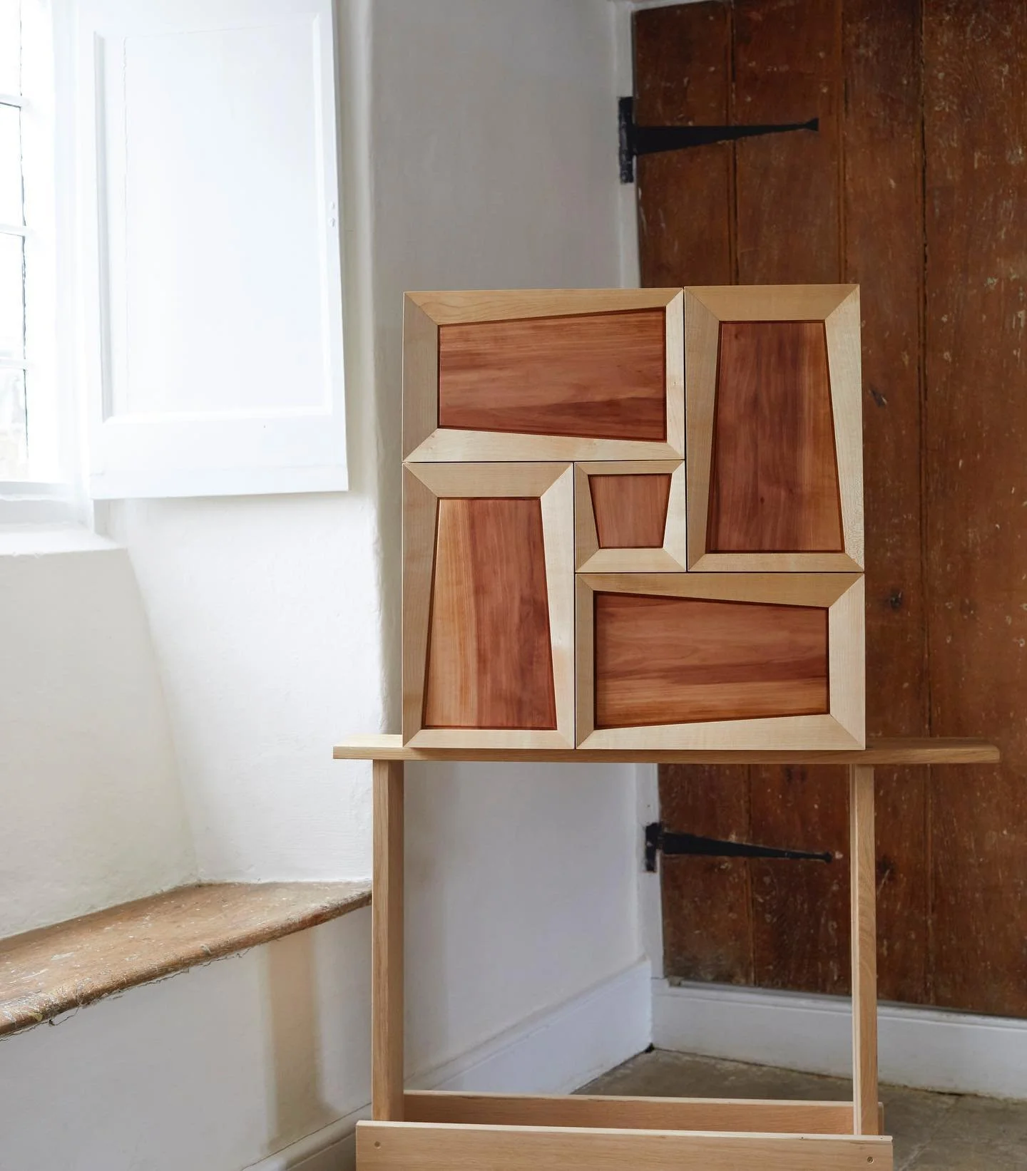 Called it the Radiant Cabinet as the angled door frames resemble the geometry and refraction of a diamond. 

Made with English sycamore for the frames and Wild service for the panels. Wild service is an incredibly beautiful UK native tree that can on