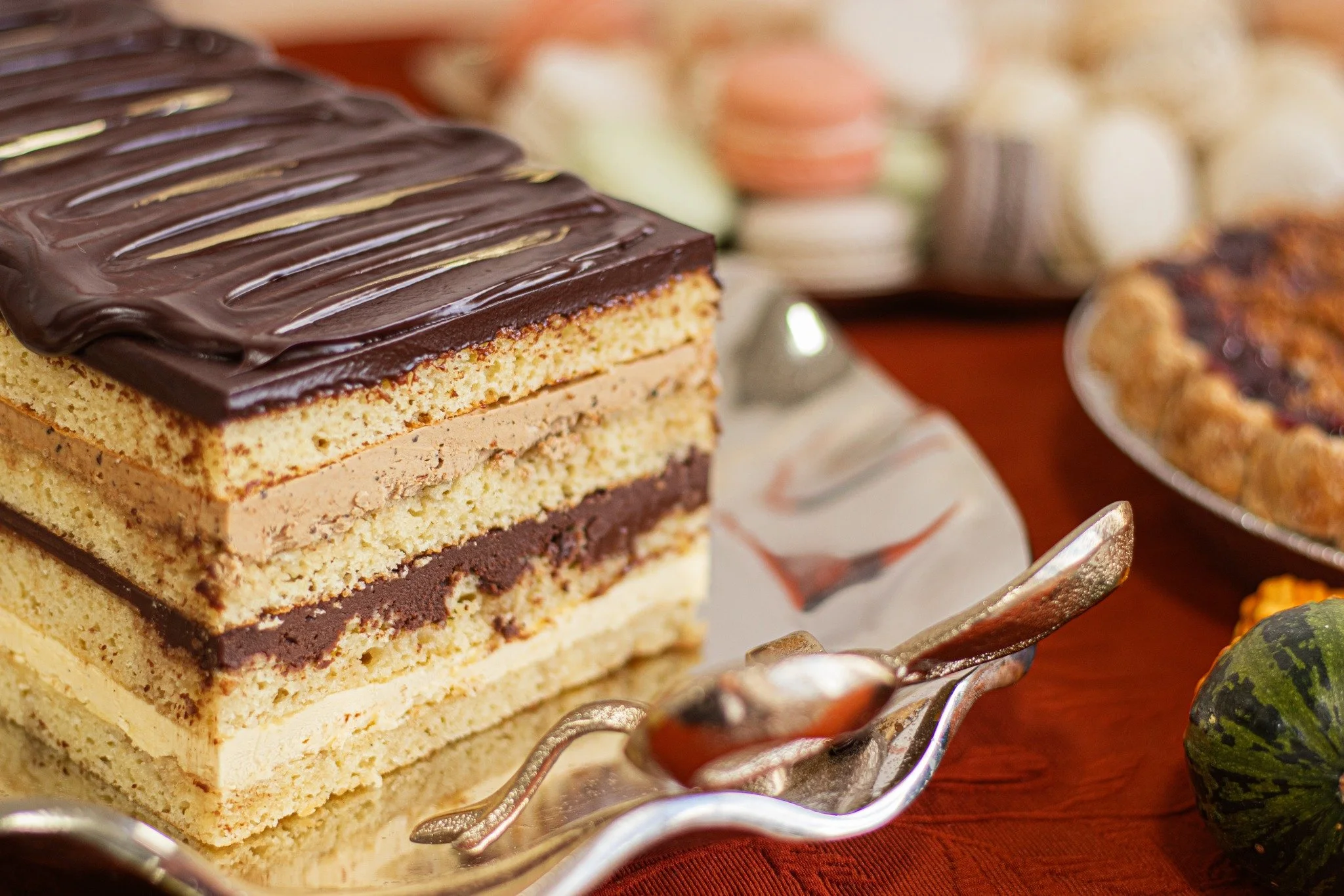 Our Grand Opera Cake is something you don't want to miss! With hazelnut sponge cake, vanilla and coffee French buttercream, and chocolate ganache layers, this cake is rich and decadent. 
.
PRE-ORDER ONLINE NOW: whiskandarrow.com/thanksgiving
.
#whisk