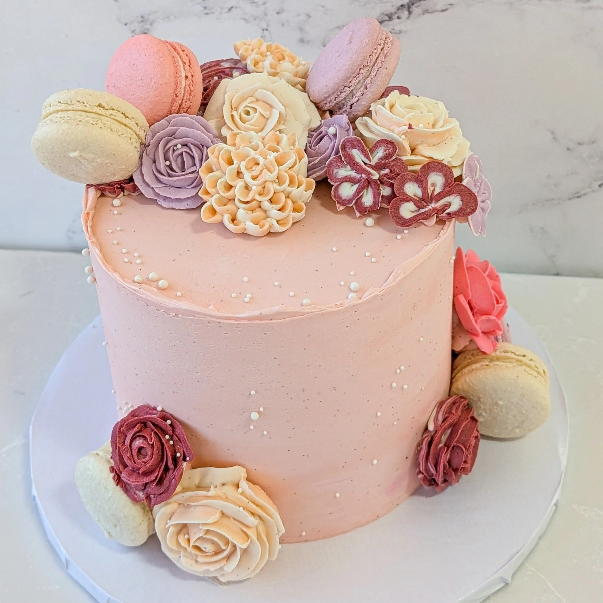 The flowers on this cake are stunning, it's amazing what our cake can do with some buttercream. 
.
To order your own custom cake:
Email us here: info@whiskandarrow.com
or call us: 920-815-3645
.
-Cake details-
Size: 8-inch premium
Add-ons: pink butte