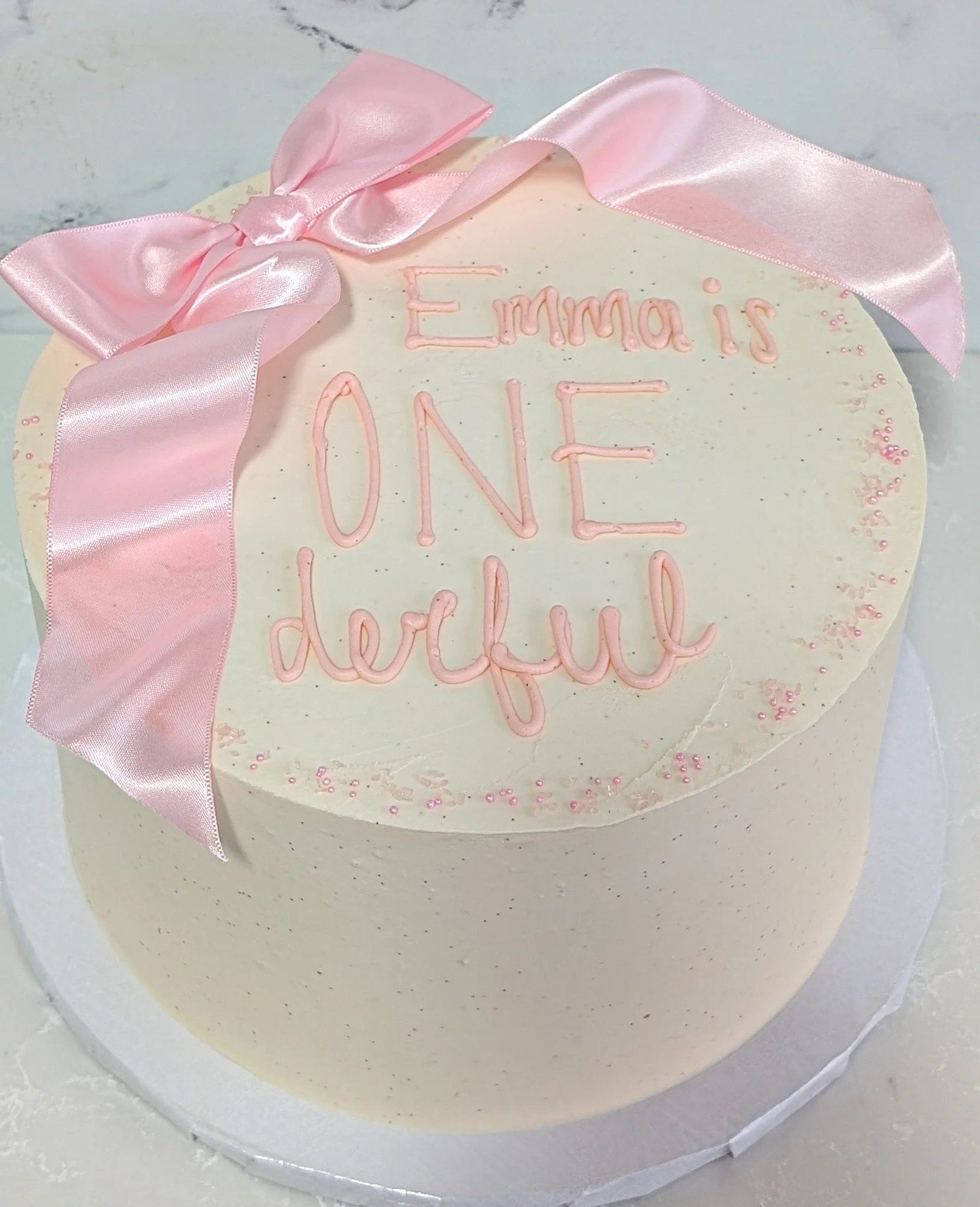 Will bow cakes ever go out of style? I hope not! I also love this shade of pink, it's so pretty. 
.
To order your own custom cake:
Email us here: info@whiskandarrow.com
or call us: 920-815-3645
.
-Cake details-
Size: 8-inch premium 
Add-ons: vanilla 