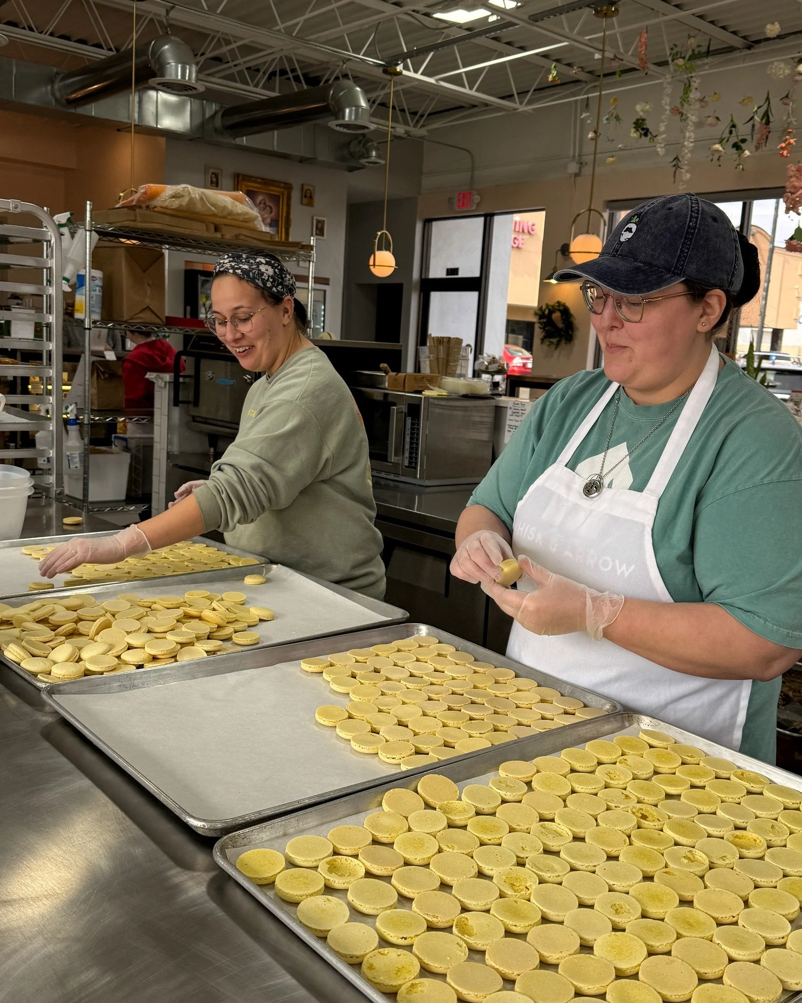 Serina and Sarah are hard at work pairing macarons today! 
.
Stop in or order online thru our app for pickup or delivery! Located in Appleton, Wisconsin. 
.
#whiskandarrow #appletonwi  #wisconsinbakery #LocalBusinessLove #macarons