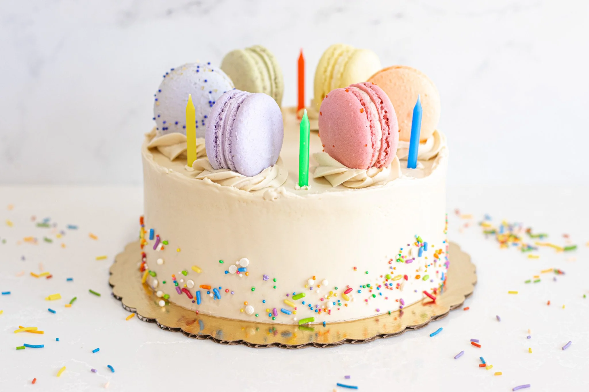 We have a new cake flavor for our menu! Meet our "Birthday Cake." This has layers of confetti cake filled with vanilla bean American buttercream. These come with macarons on top and candles! 
.
Stop into our store at 1915 N Richmond Street 