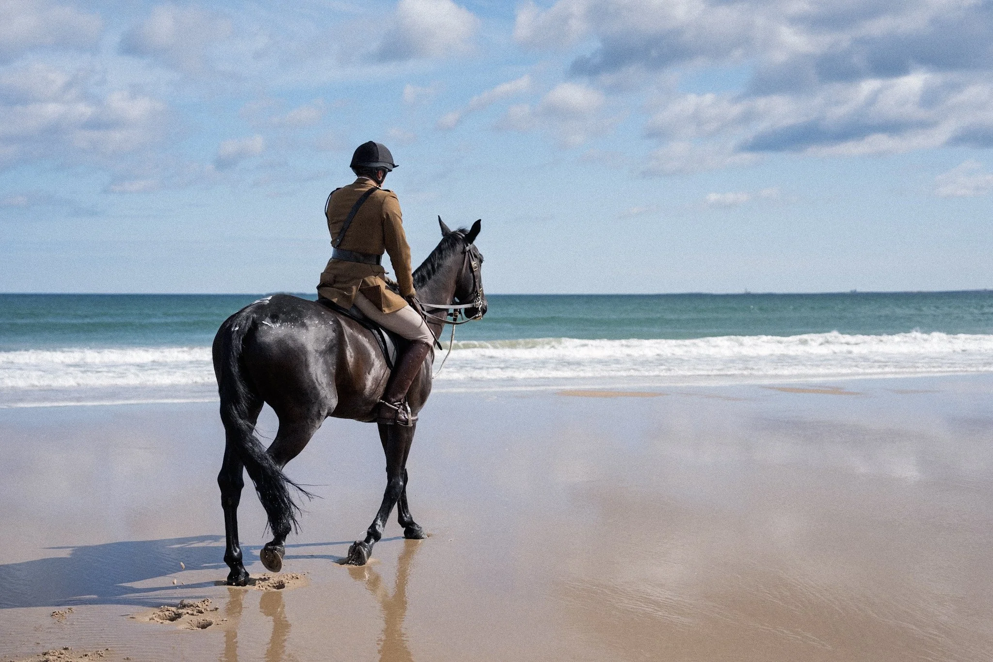 Captain of the household cavalry on horseback on Bamburgh beach by Jim Scott Photography