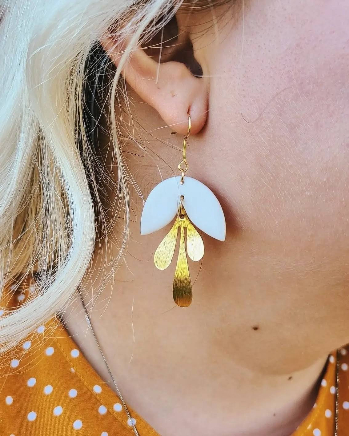 Handcrafted polymer clay earrings. White and gold dangle earring. All components are gold plated, silver plated, or stainless steel with sensitive ears in mind.