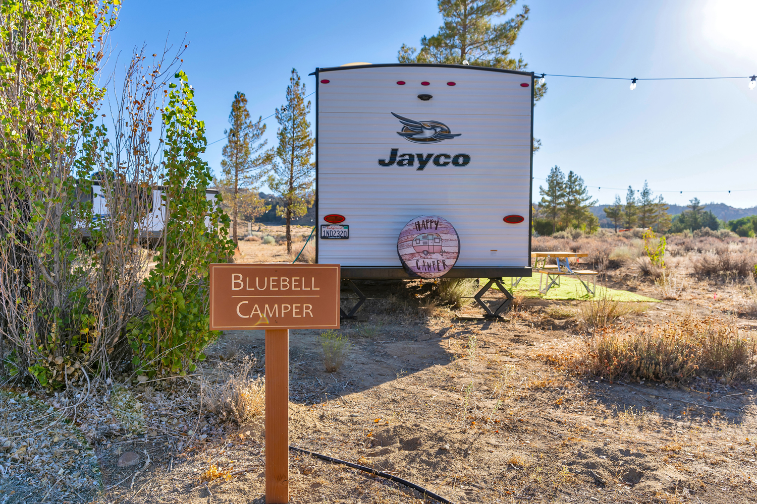loveology-retreat-center-BLUEBELL-CAMPER-_-SIGN.png