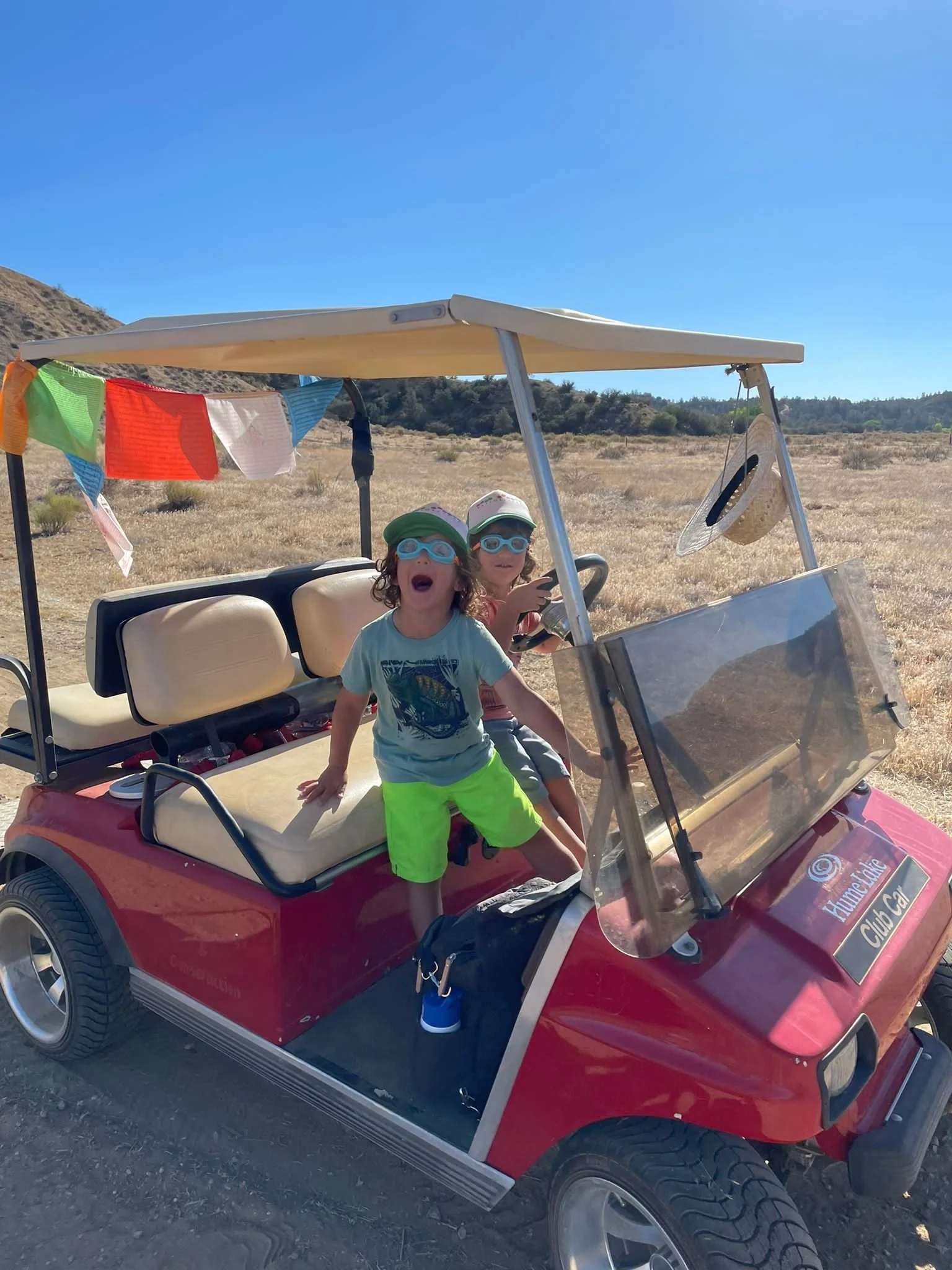 Mikah & Tall having fun in the golf cart