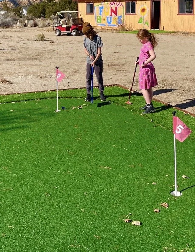 Mason & Hannah playing on the Putting Green