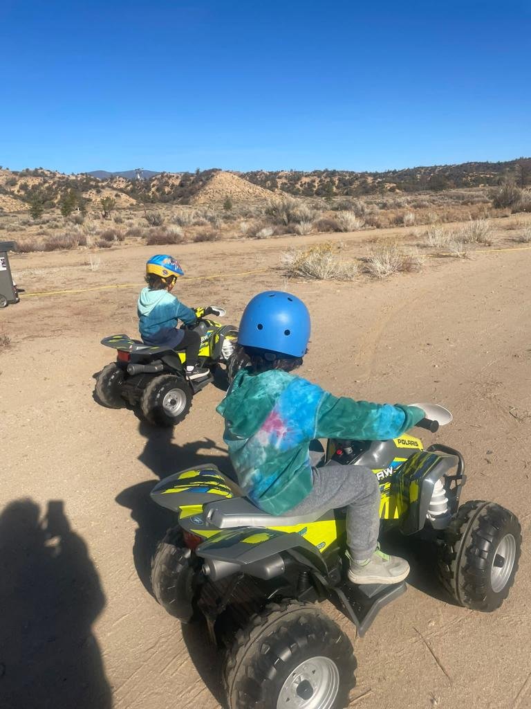 Twins Mikah & Tal having fun on their new Monster Trucks