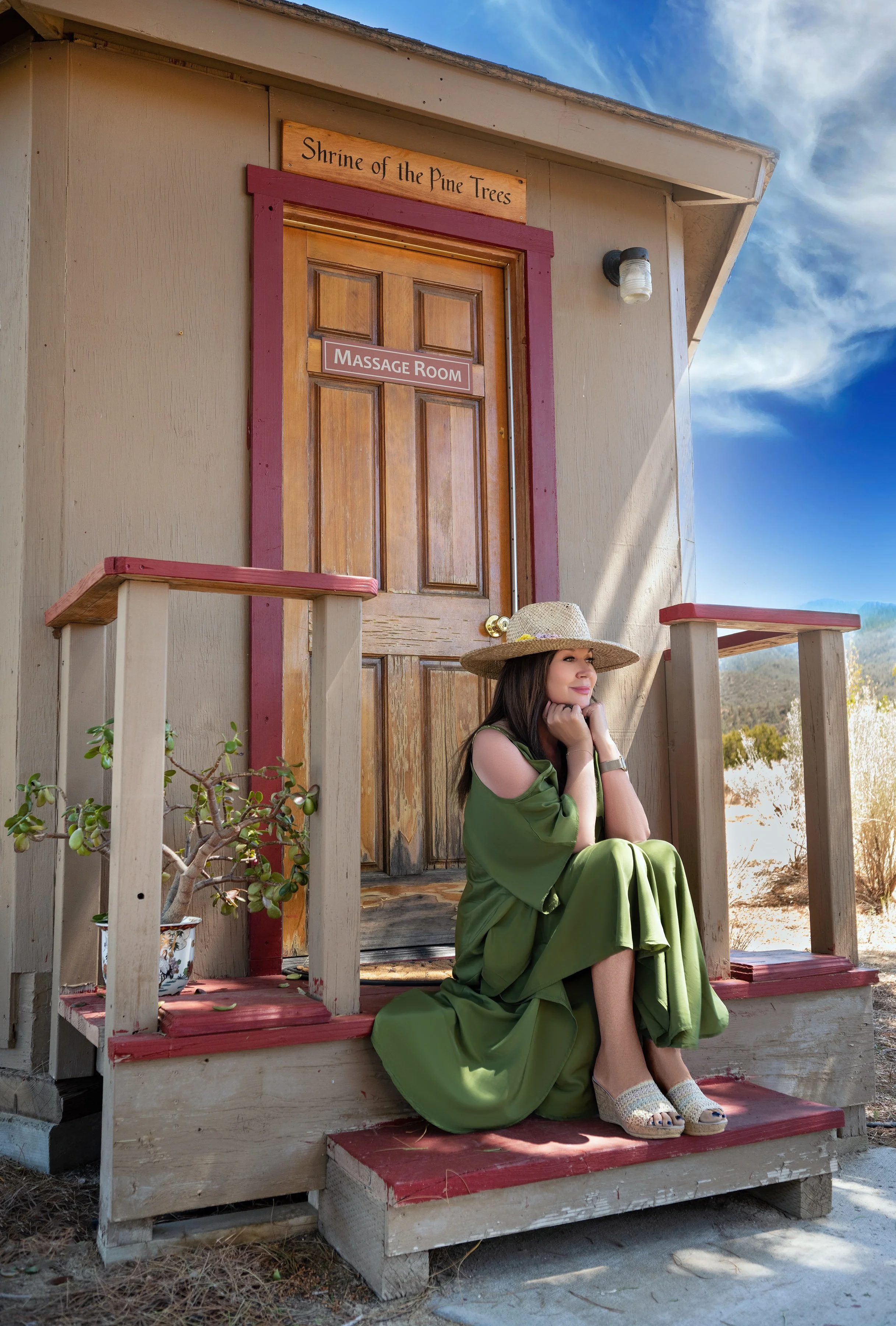 Dr. Ava relaxing in front of the Massage Room 