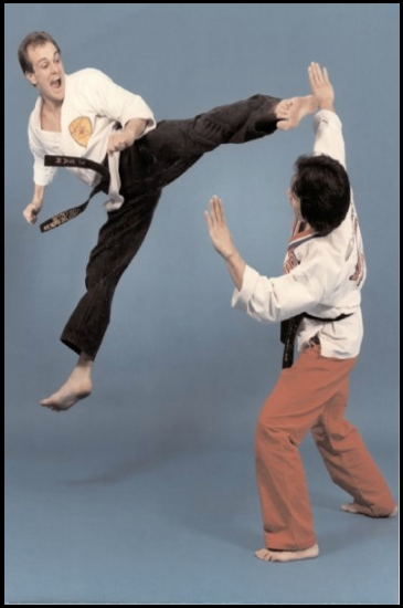 Kicking at my instructor, Ernie Reyes, Sr. In the 1980's, photo by Gary Decapua of Reno.