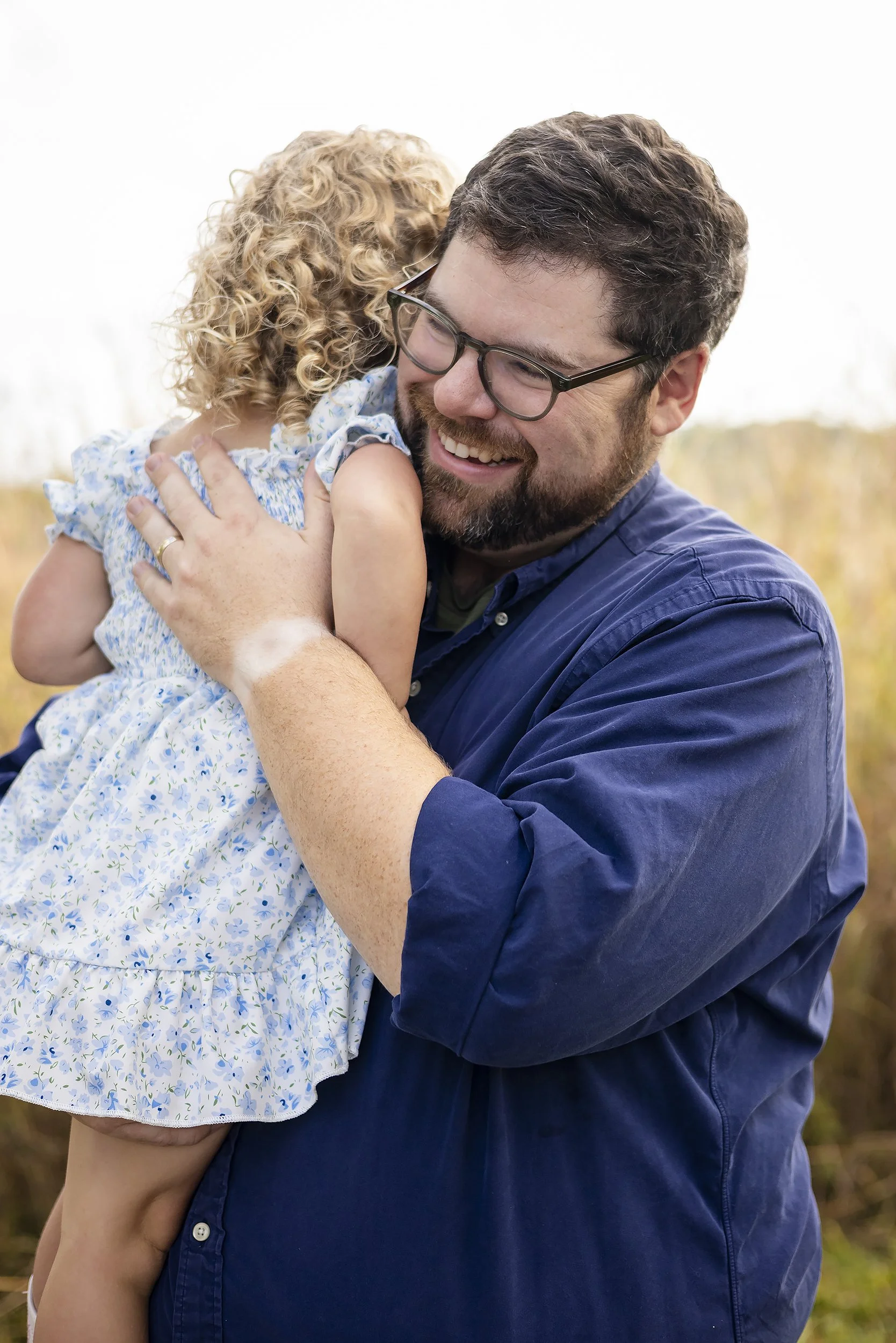 father-hugs-daughter-lifestyle-family-portraits.JPG