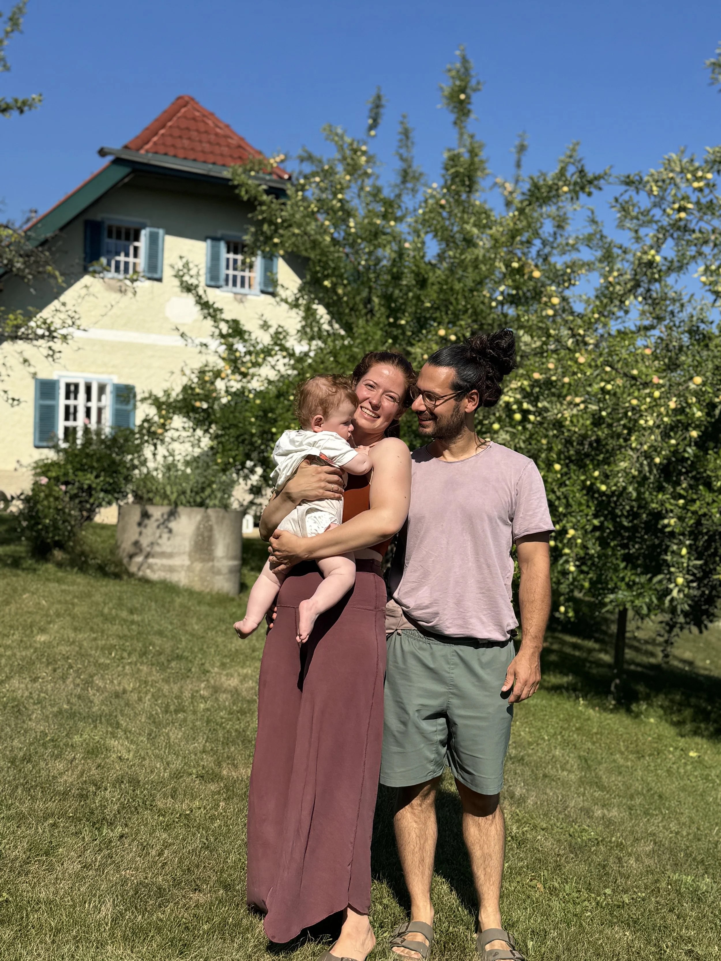 Us in front of house.jpg