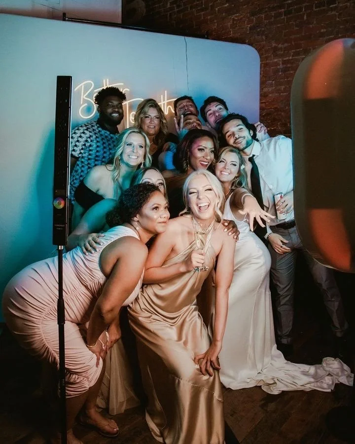 Photo booth. Women posing in front of a photo booth