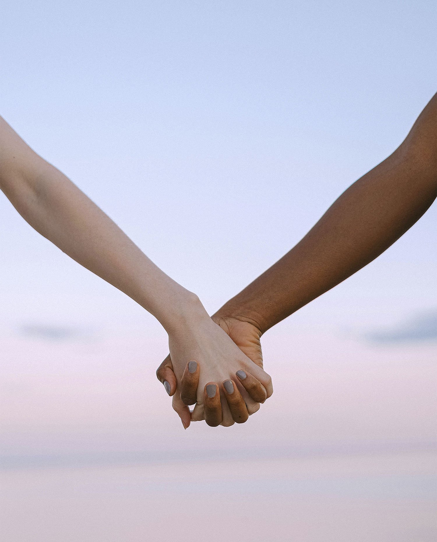 Couple holding hands, represents how you can move from past hurt and build healthier relationships with the support of an attachment-based therapist in Los Angeles & Pasadena, CA.