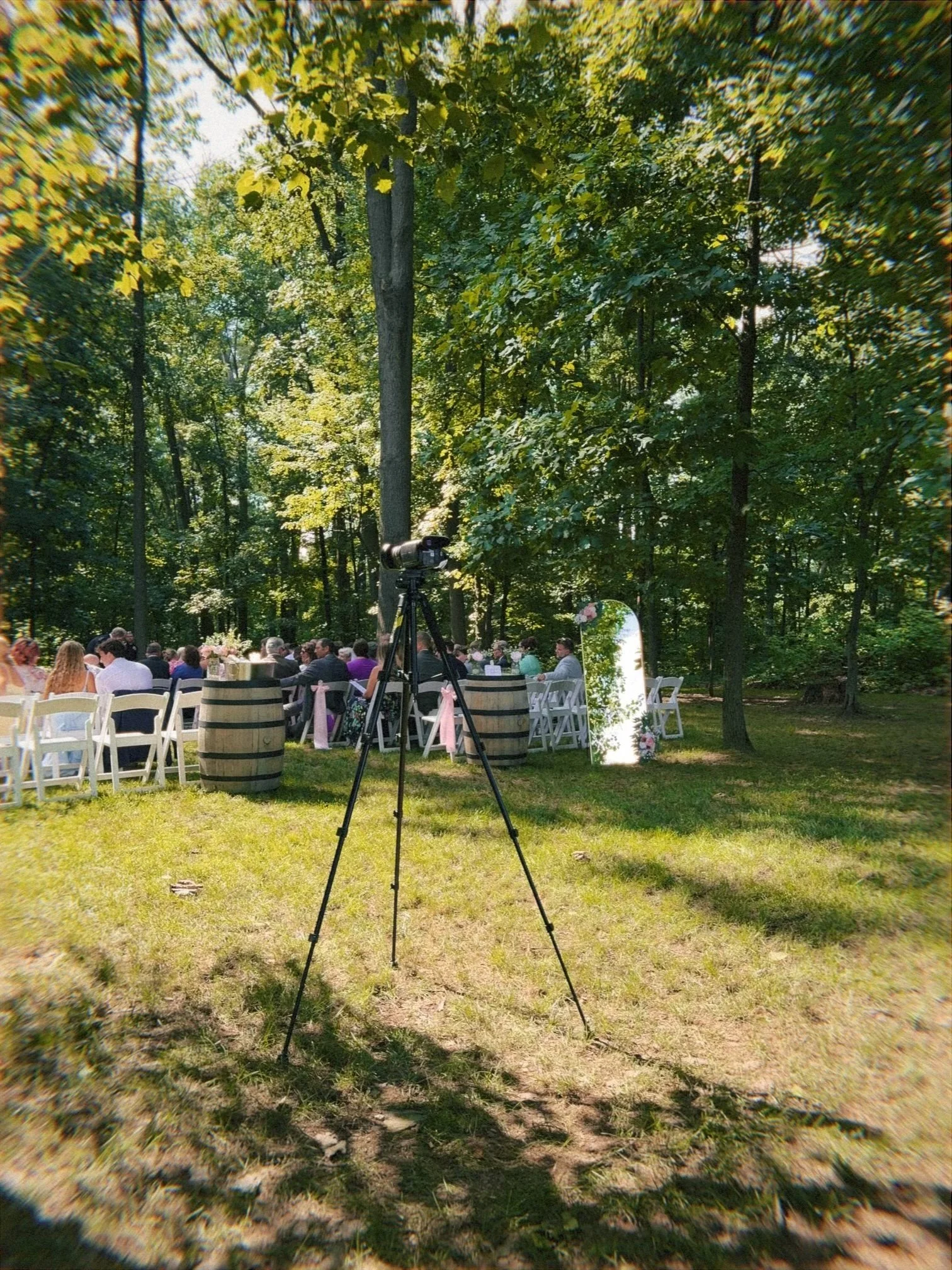 Wedding videographer camcorder setup at outdoor wedding