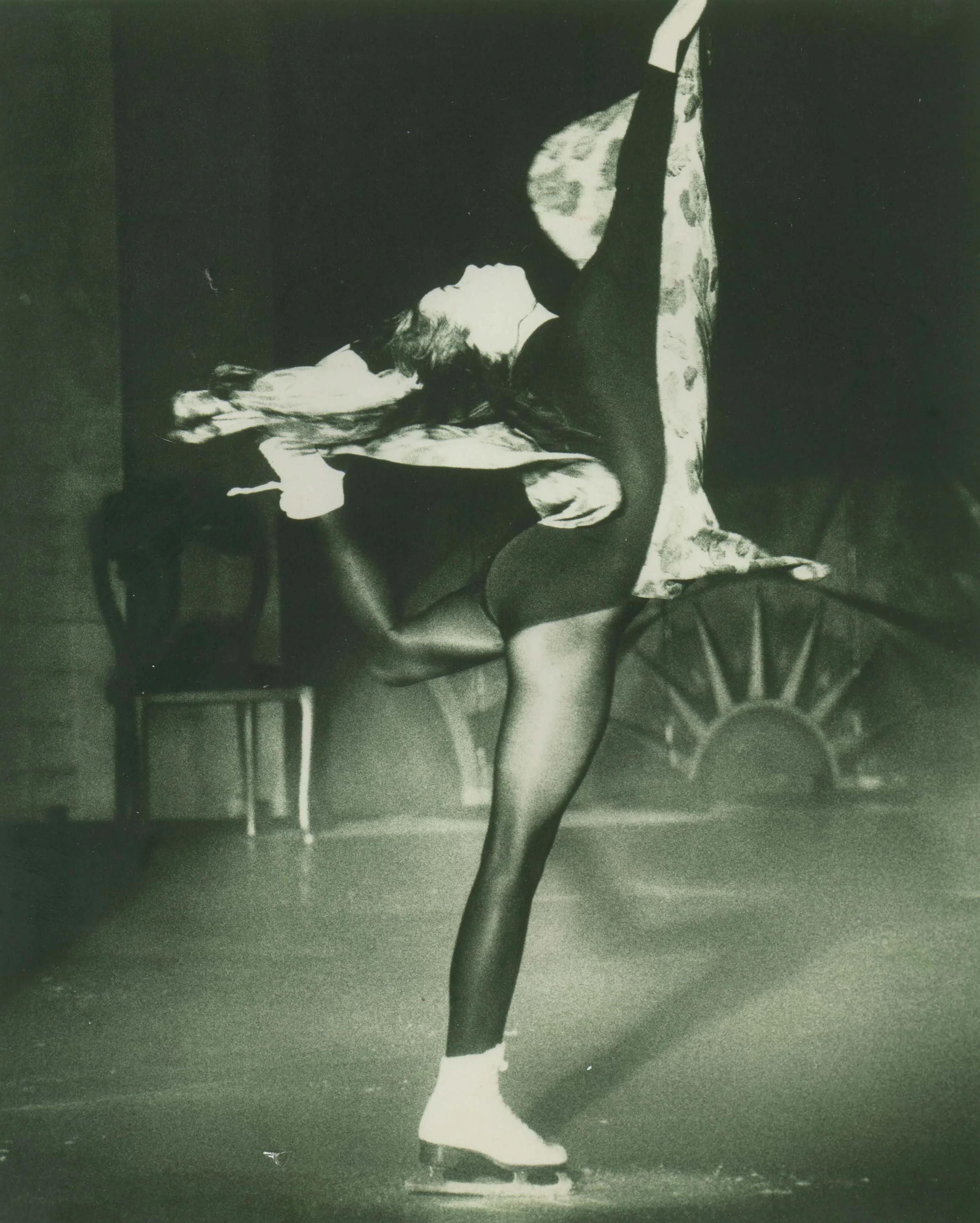Roller Boogie performing layback spin on ice skates at NYC skating event