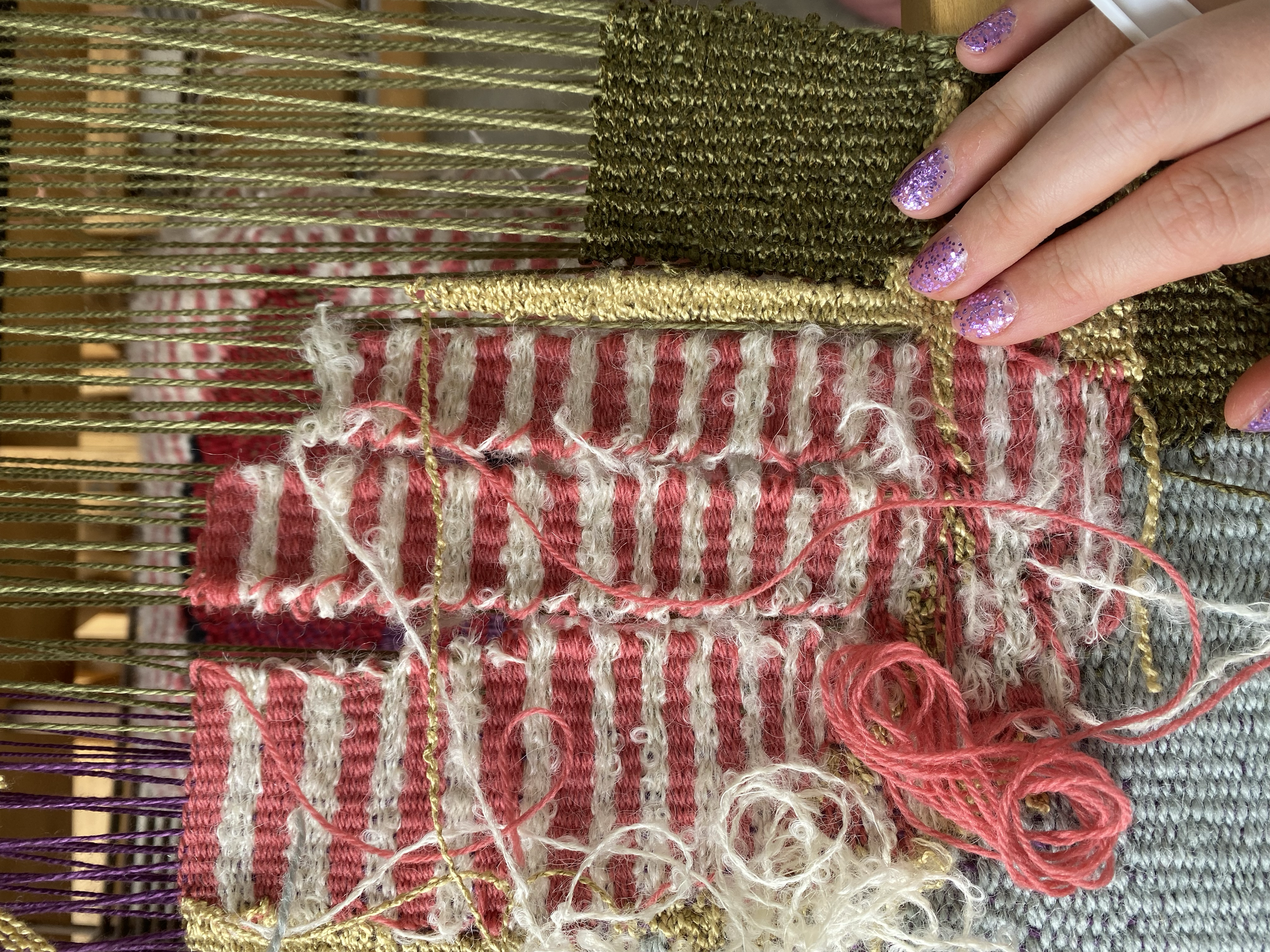 weaving with sparkly purple nails