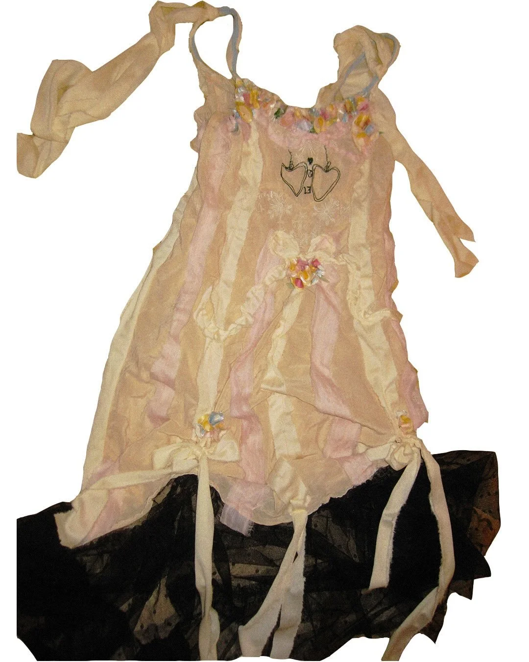 Reworked vintage slip dress with hand sewn flowers 

I&rsquo;ve had this dress a few years and I believe it&rsquo;s from the 30s but my memory could be incorrect. the embroidered locket up top was the only thing added to it ~3 years ago, and i decide