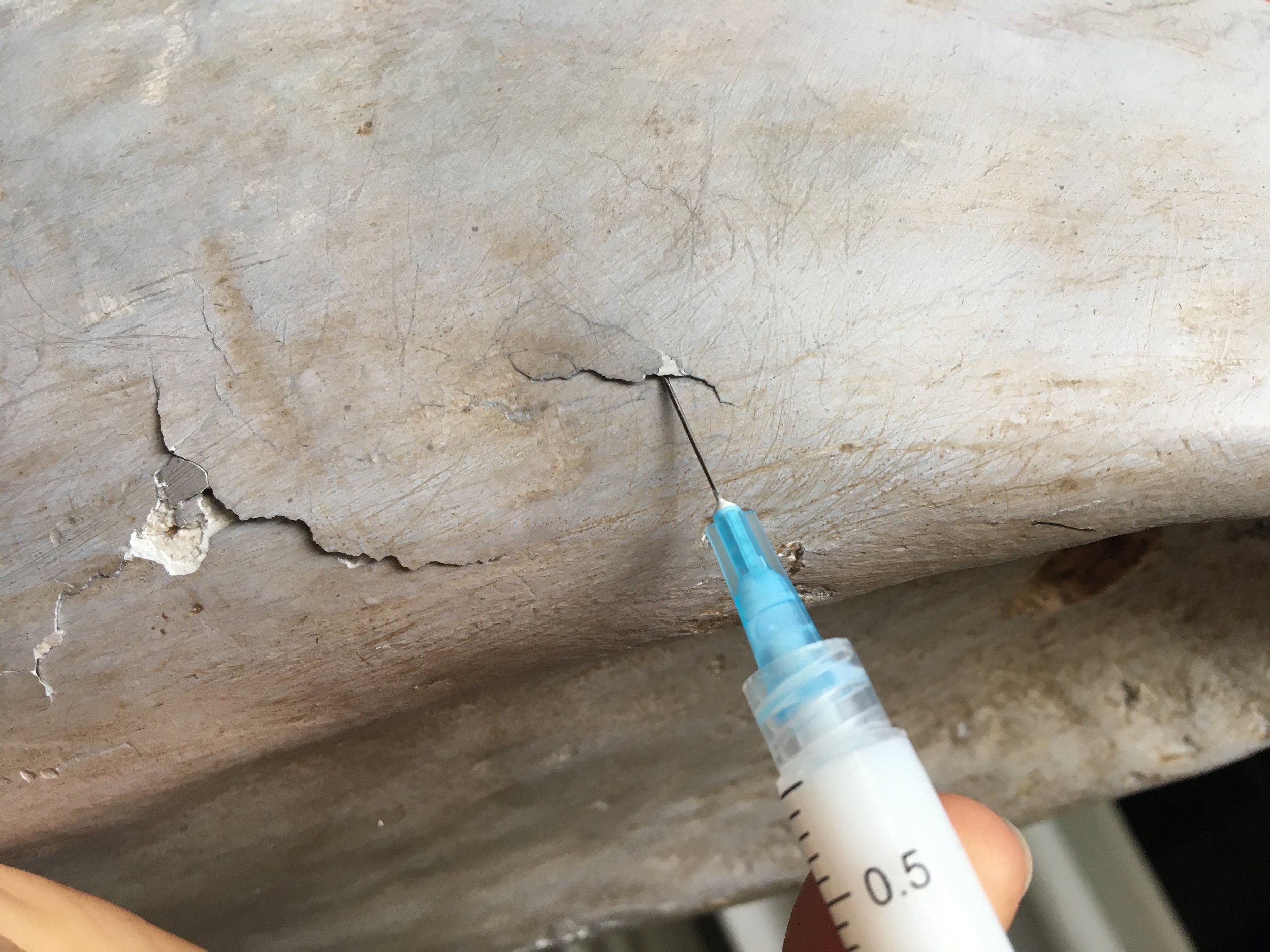 Injection of conservation grade consolidants to stabilize the surface and prevent any further losses.