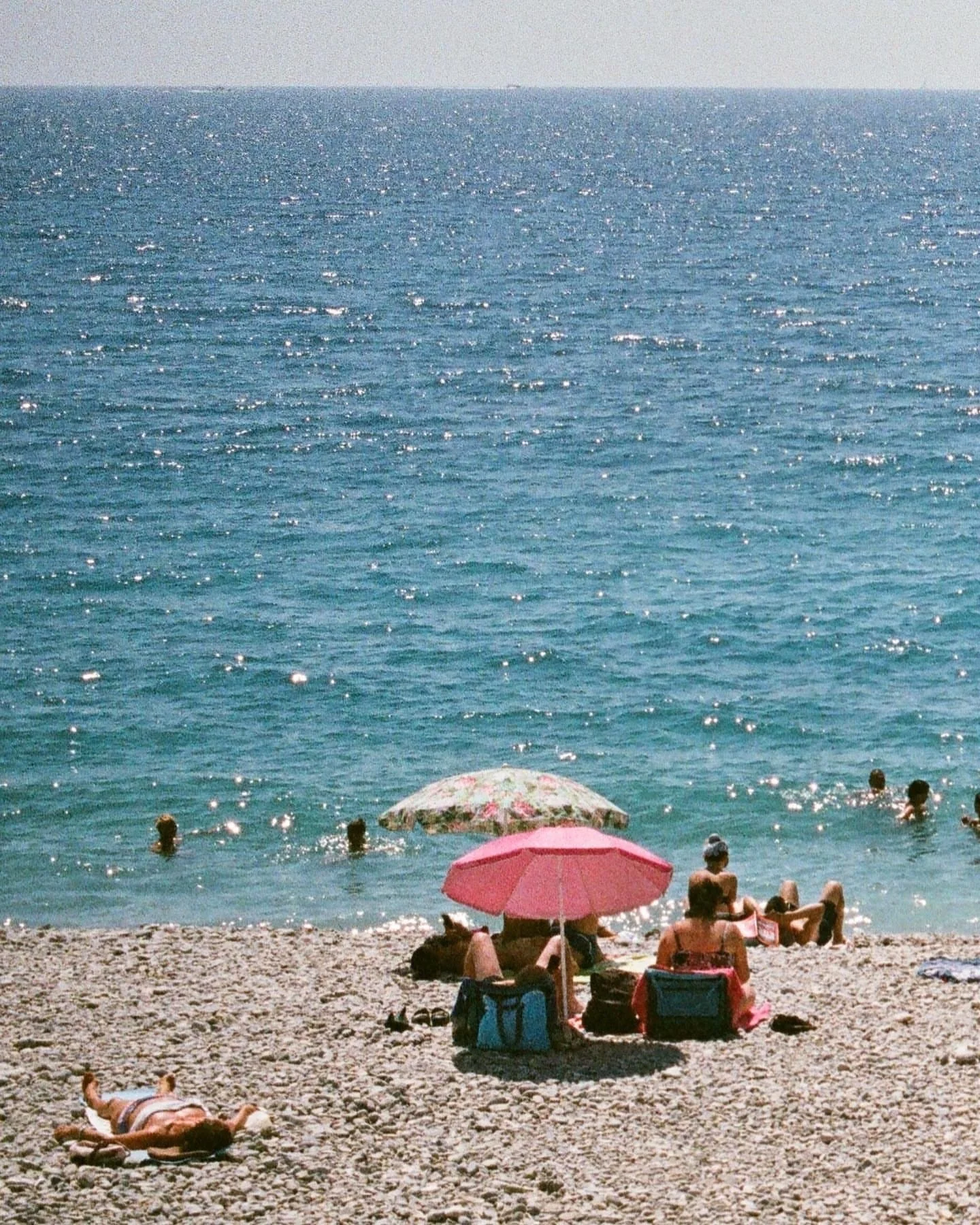 Pebbled shores, pink umbrellas, and sun-soaked simplicity. Mediterranean summer at its dreamiest.

@hollychippendale