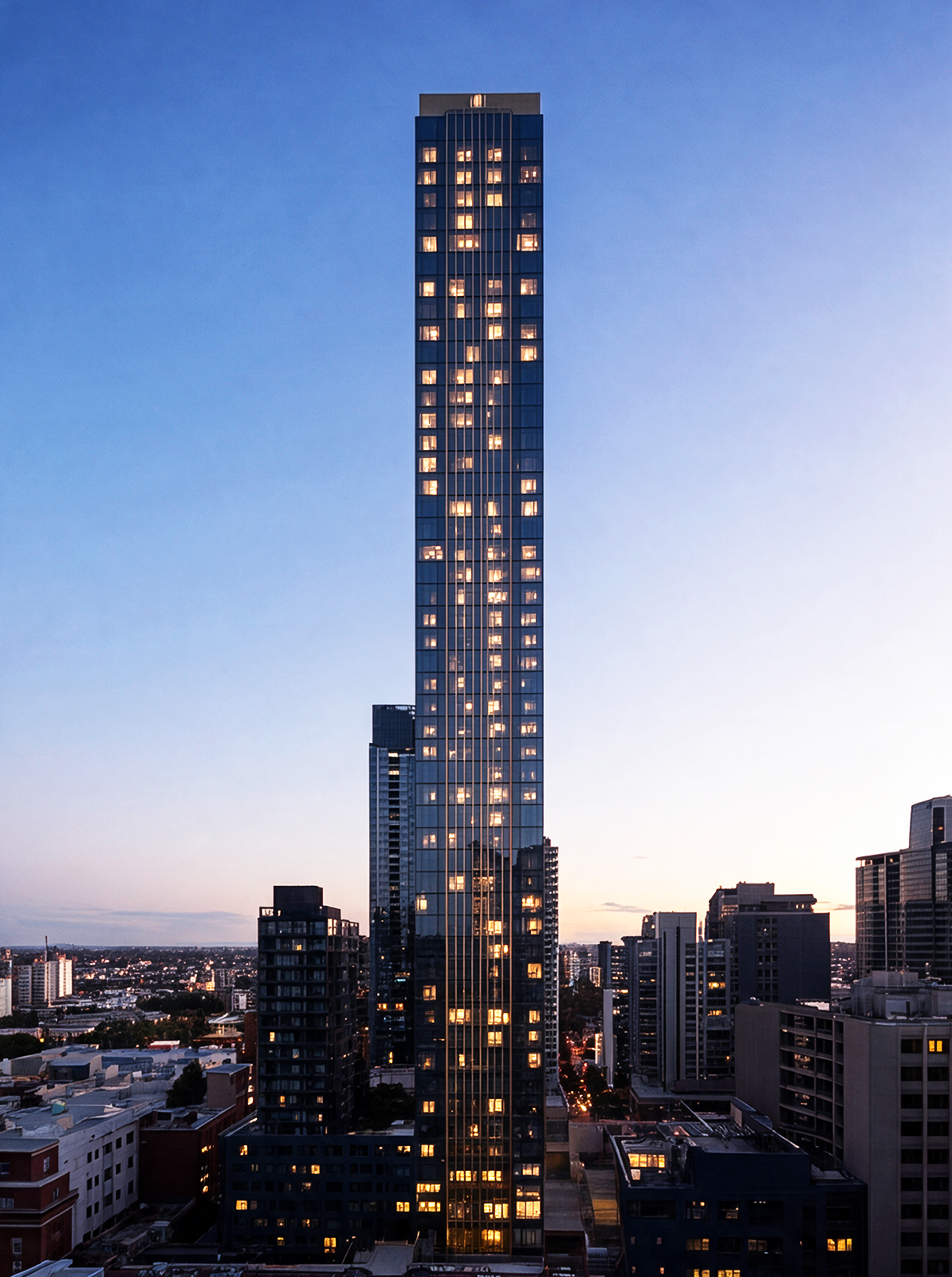Evening view of the 640 Bourke Street apartment tower rising above the Melbourne CBD skyline at dusk.