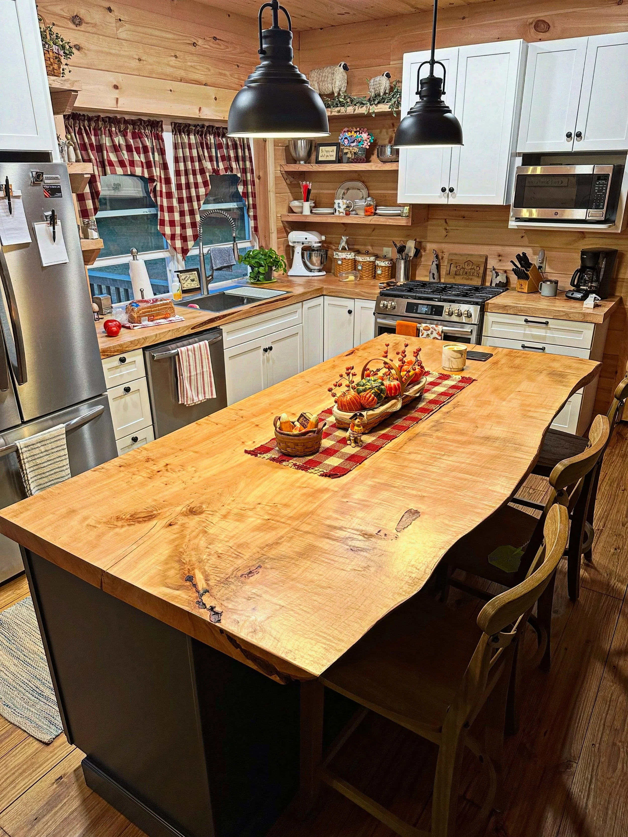 Warm, rustic kitchen with a live‑edge centerpiece that brings the whole room together.