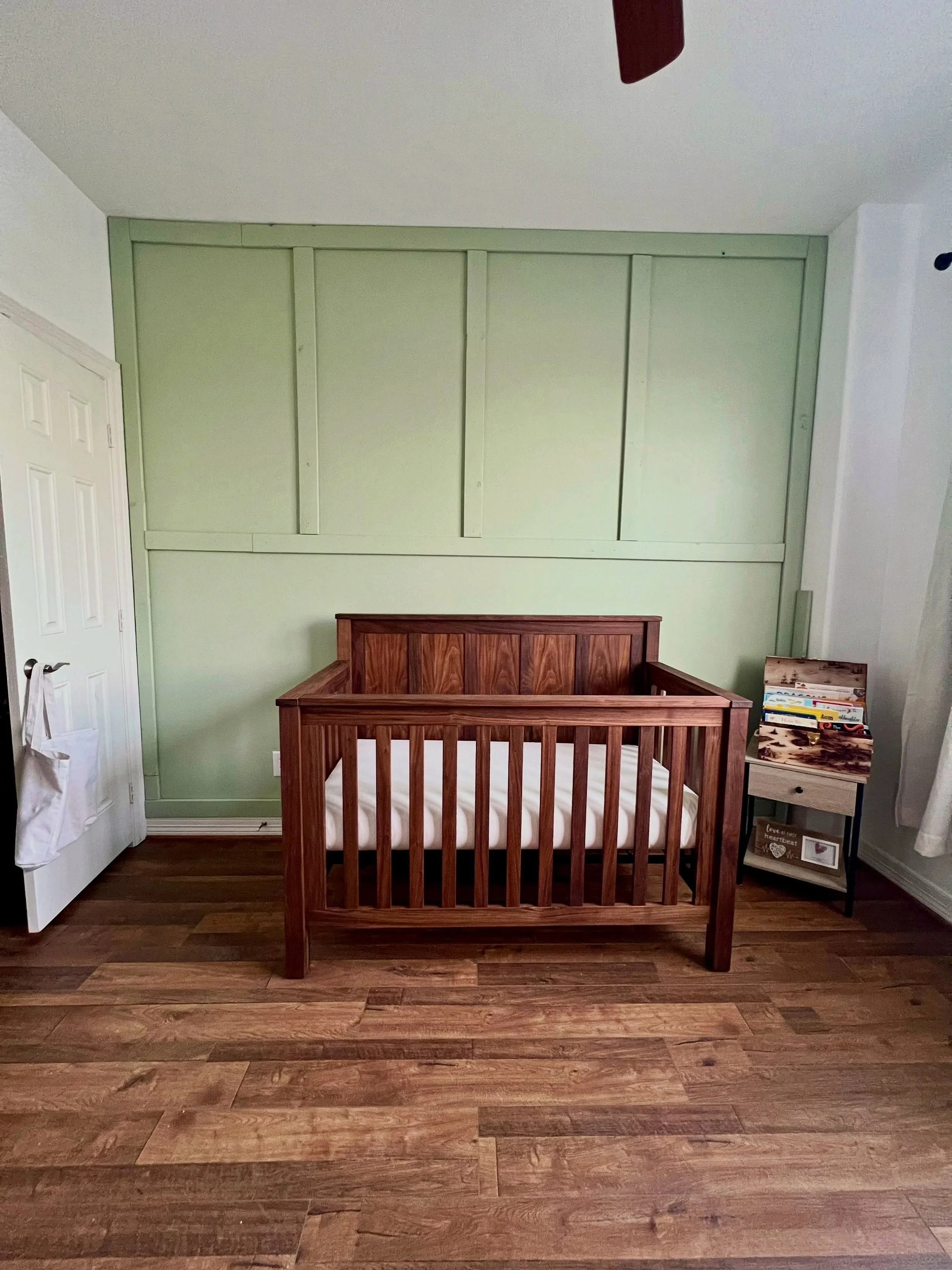 Black walnut, clean lines, and a handcrafted nursery setup built to last.