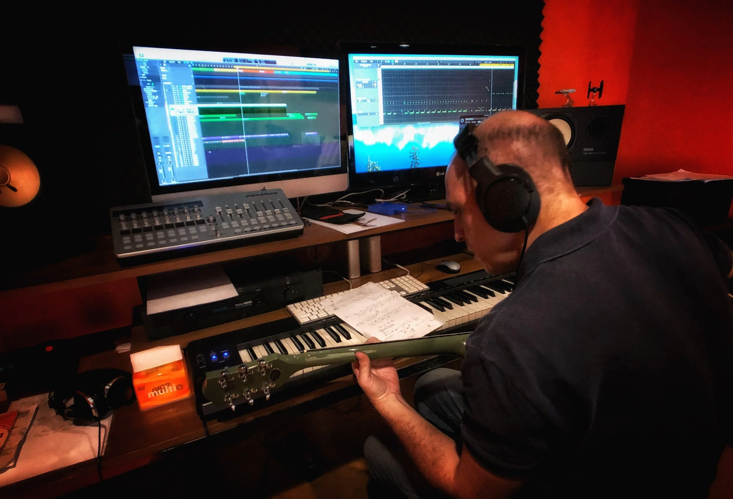 Nico playing and recording guitar for a commercial