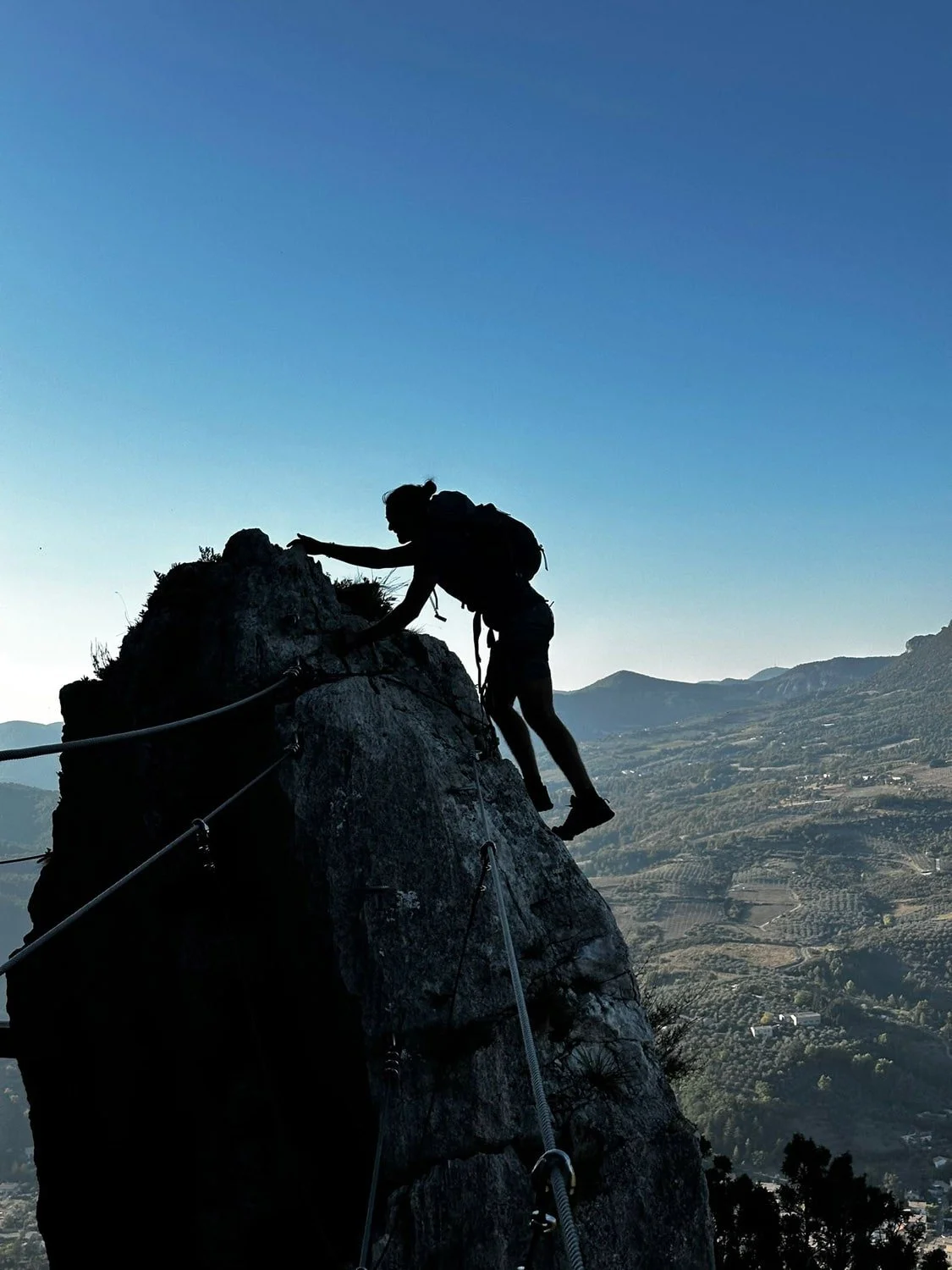 Silhouette of my husband climbing