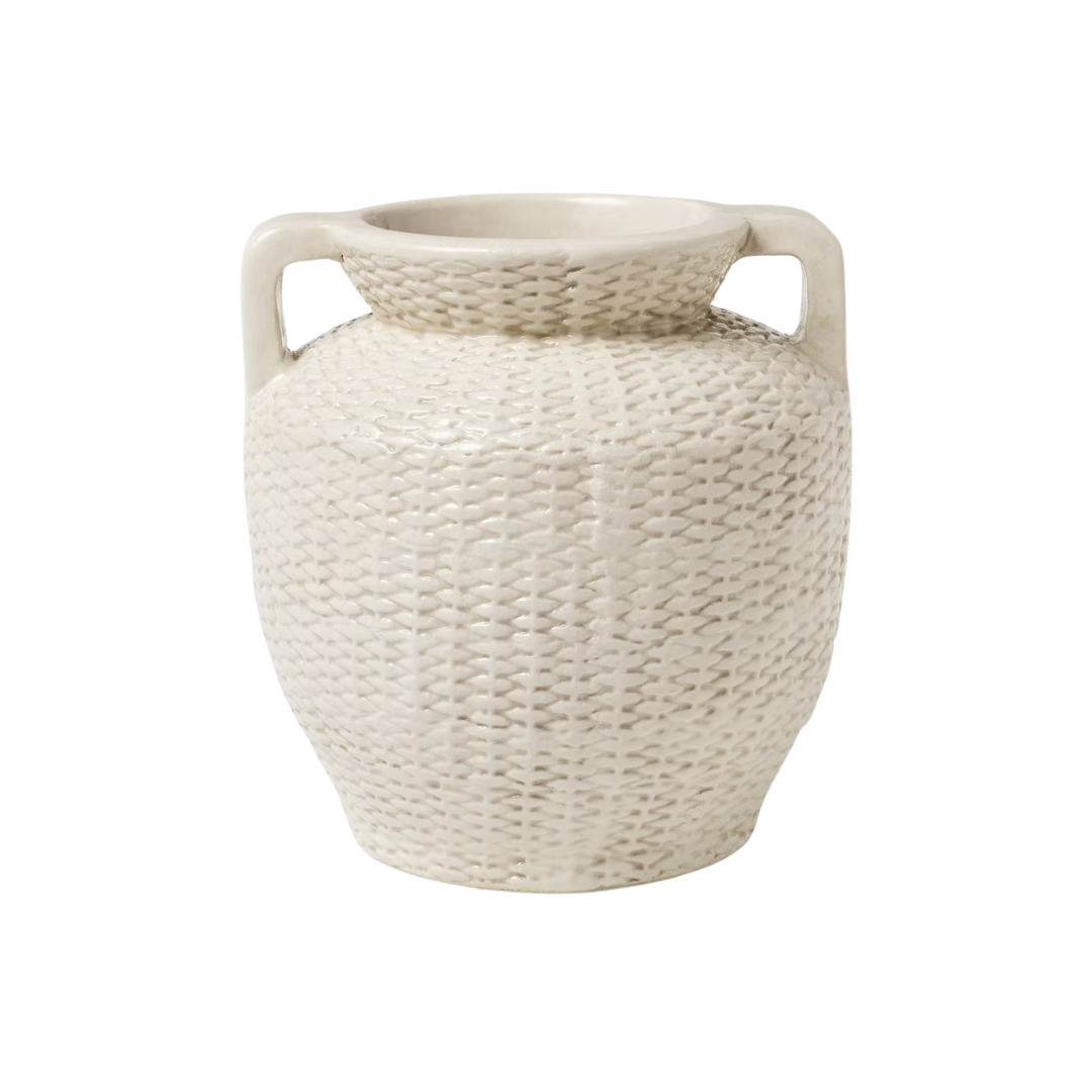 A white ceramic vase with a textured woven pattern and two small handles near the top.