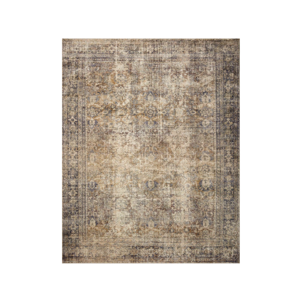 A vintage-style area rug with intricate floral and geometric patterns in shades of beige, brown, and gray.
