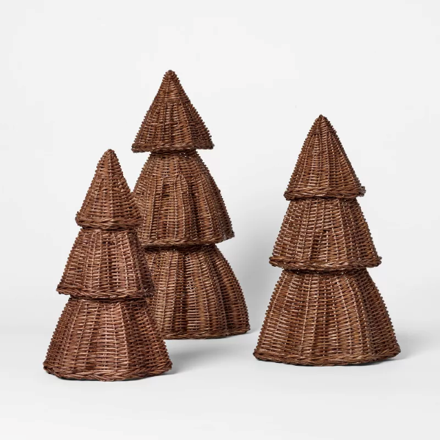 Four stacked wicker cone-shaped baskets against a plain white background.